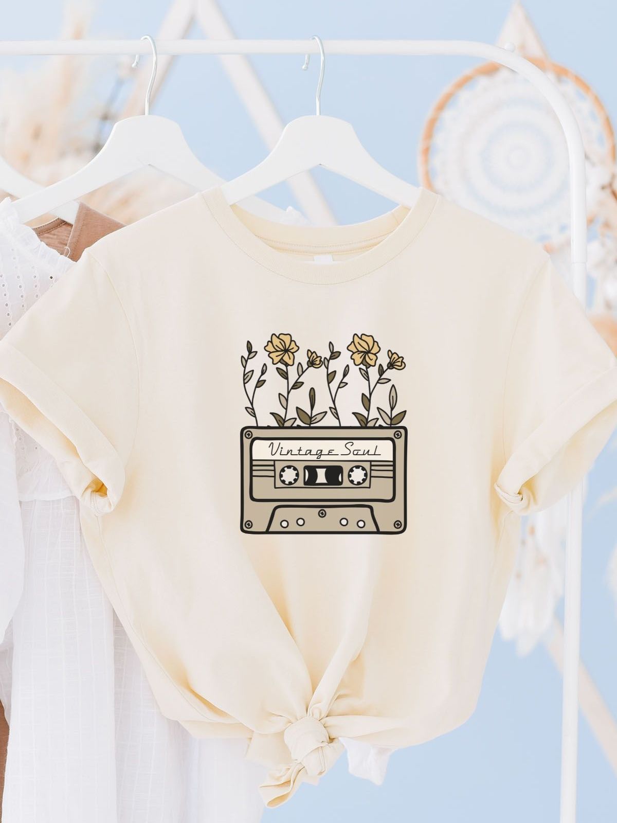 beige t-shirt with vintage cassette and floral design
