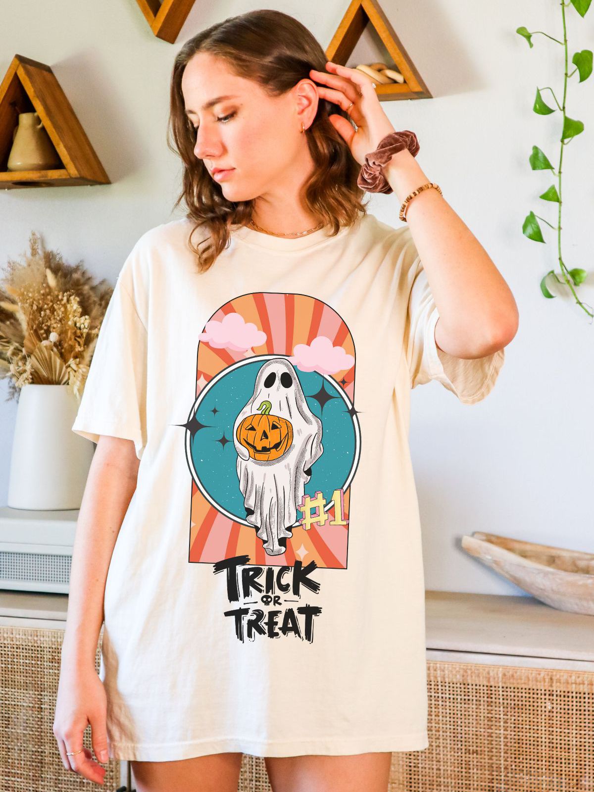 Halloween themed tee with ghost and pumpkin design