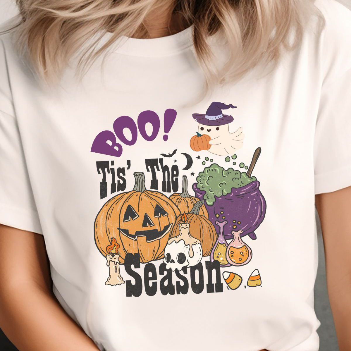 Halloween themed t-shirt with pumpkins and cauldron design