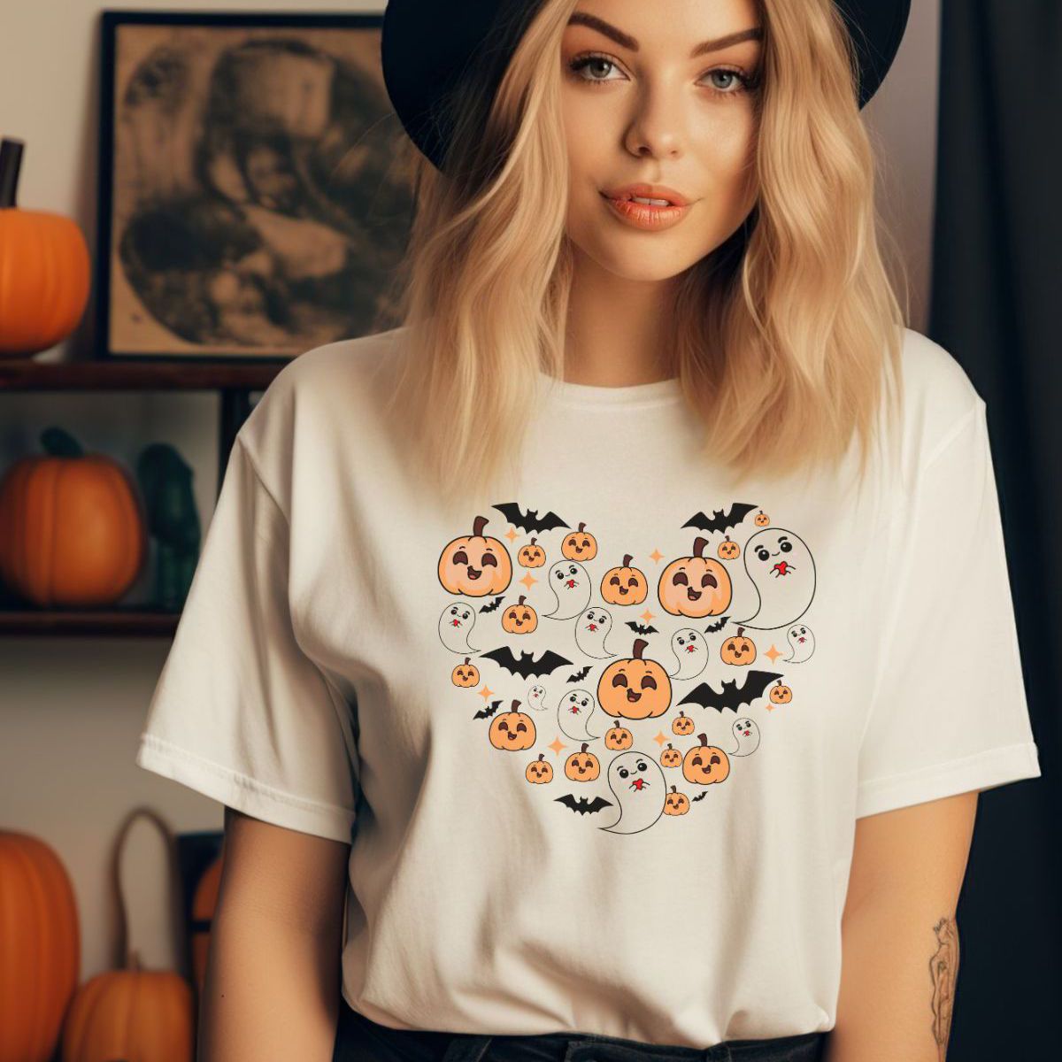 woman wearing Halloween themed t-shirt with ghosts and pumpkins