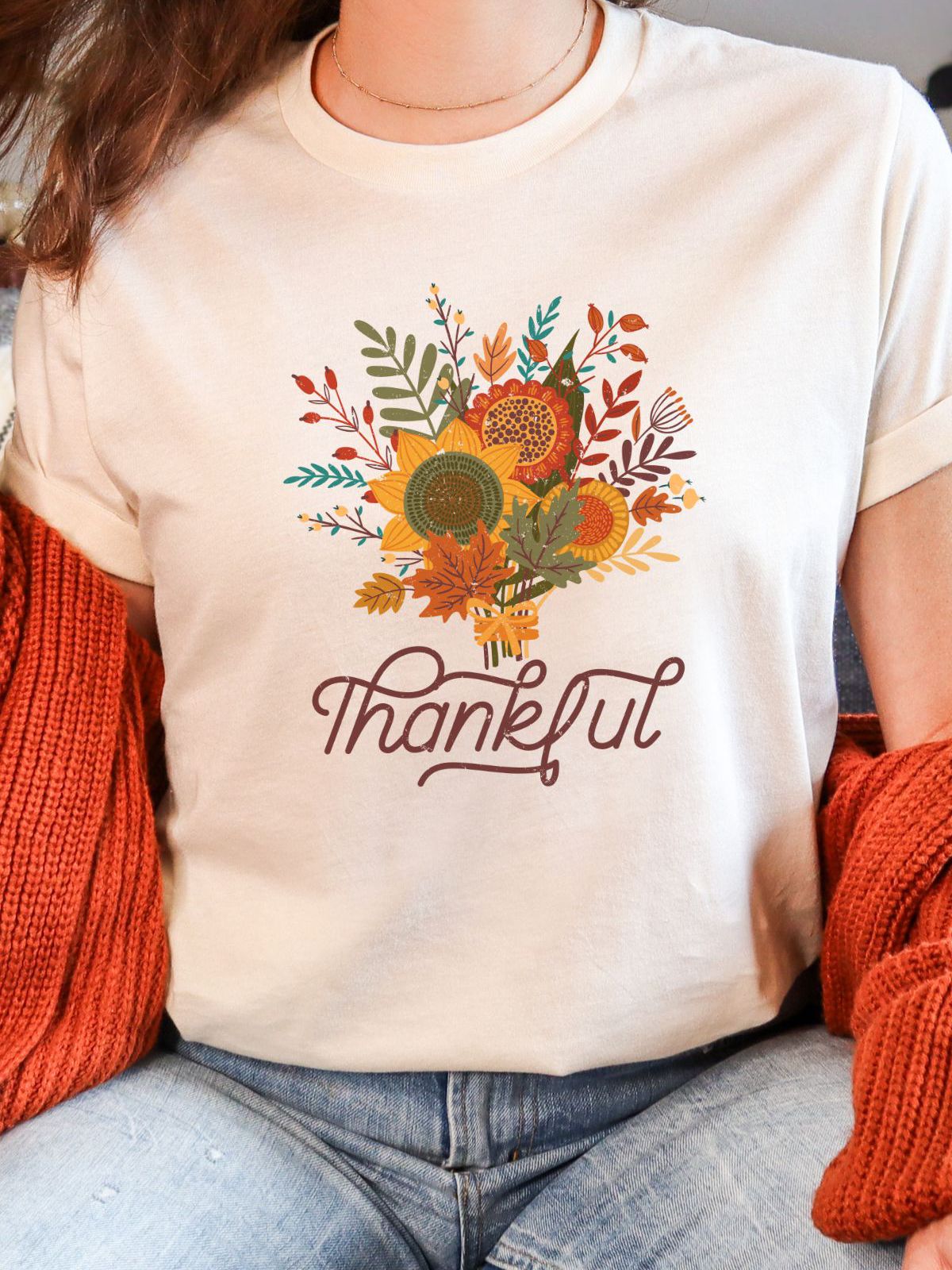 woman wearing thankful t-shirt with autumn floral design