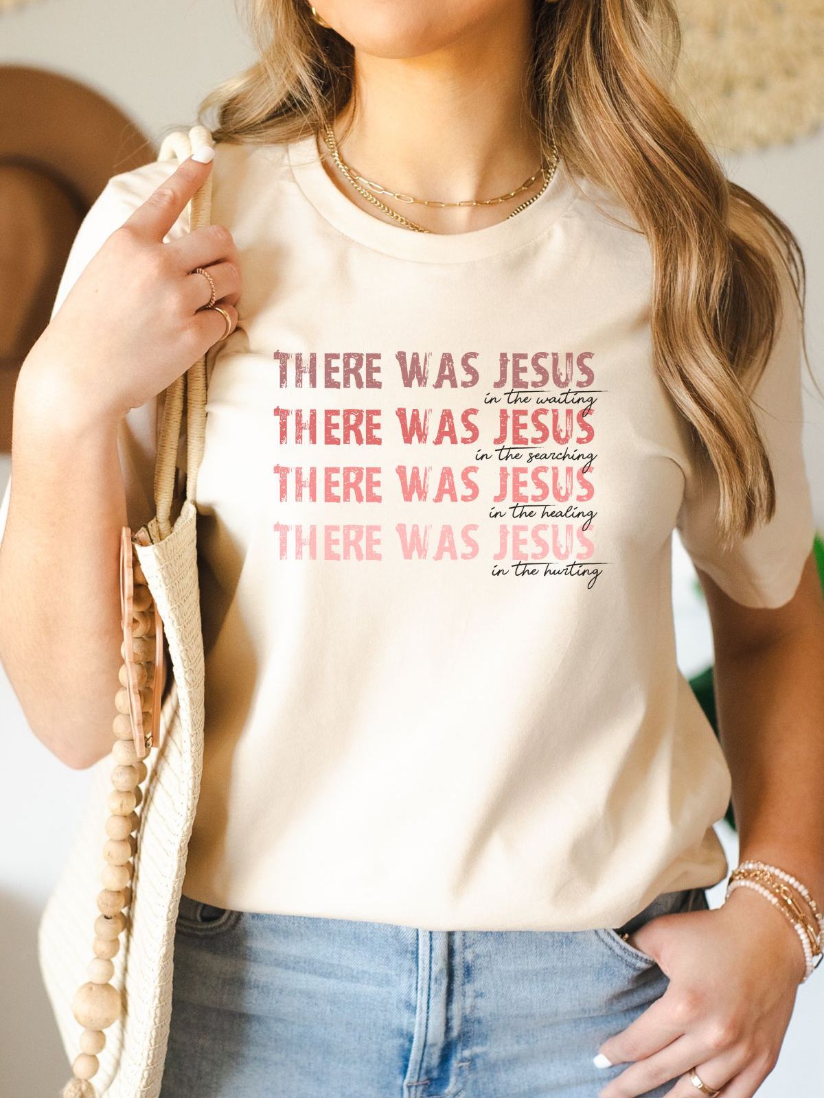 Woman wearing Jesus themed beige t-shirt