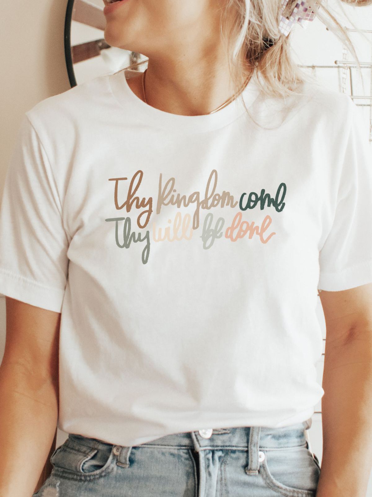 woman wearing white t-shirt with inspirational text