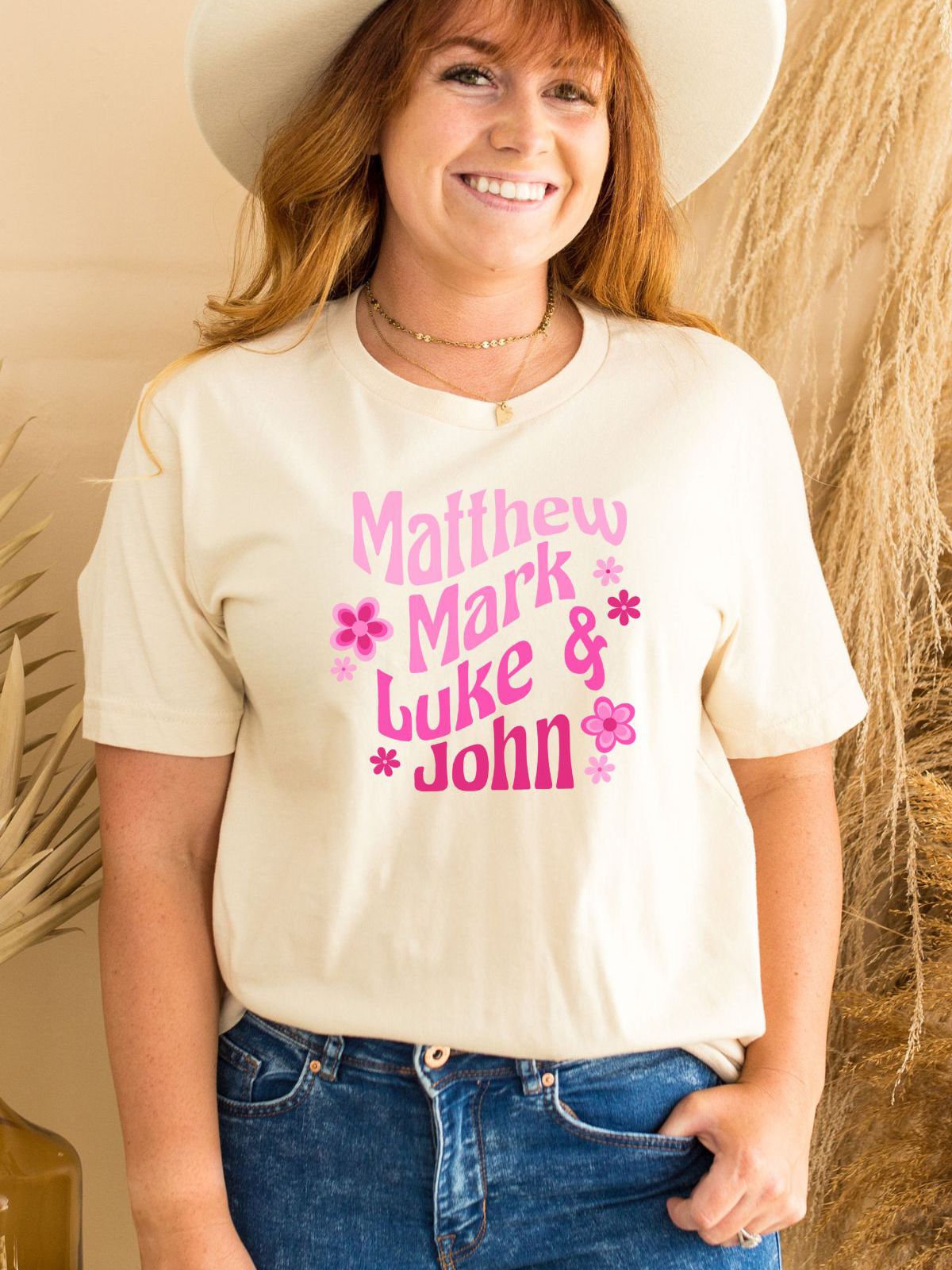 woman wearing t-shirt with floral names design