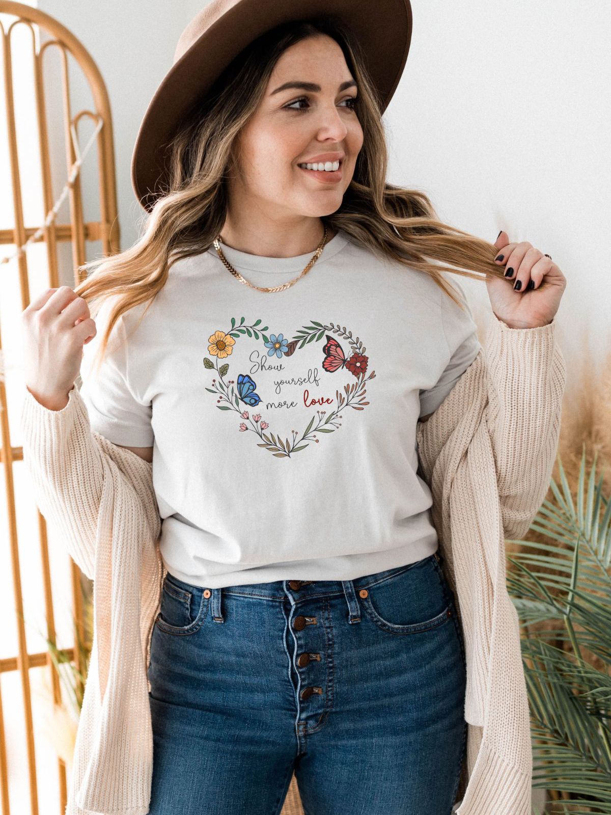 woman wearing floral heart design t-shirt