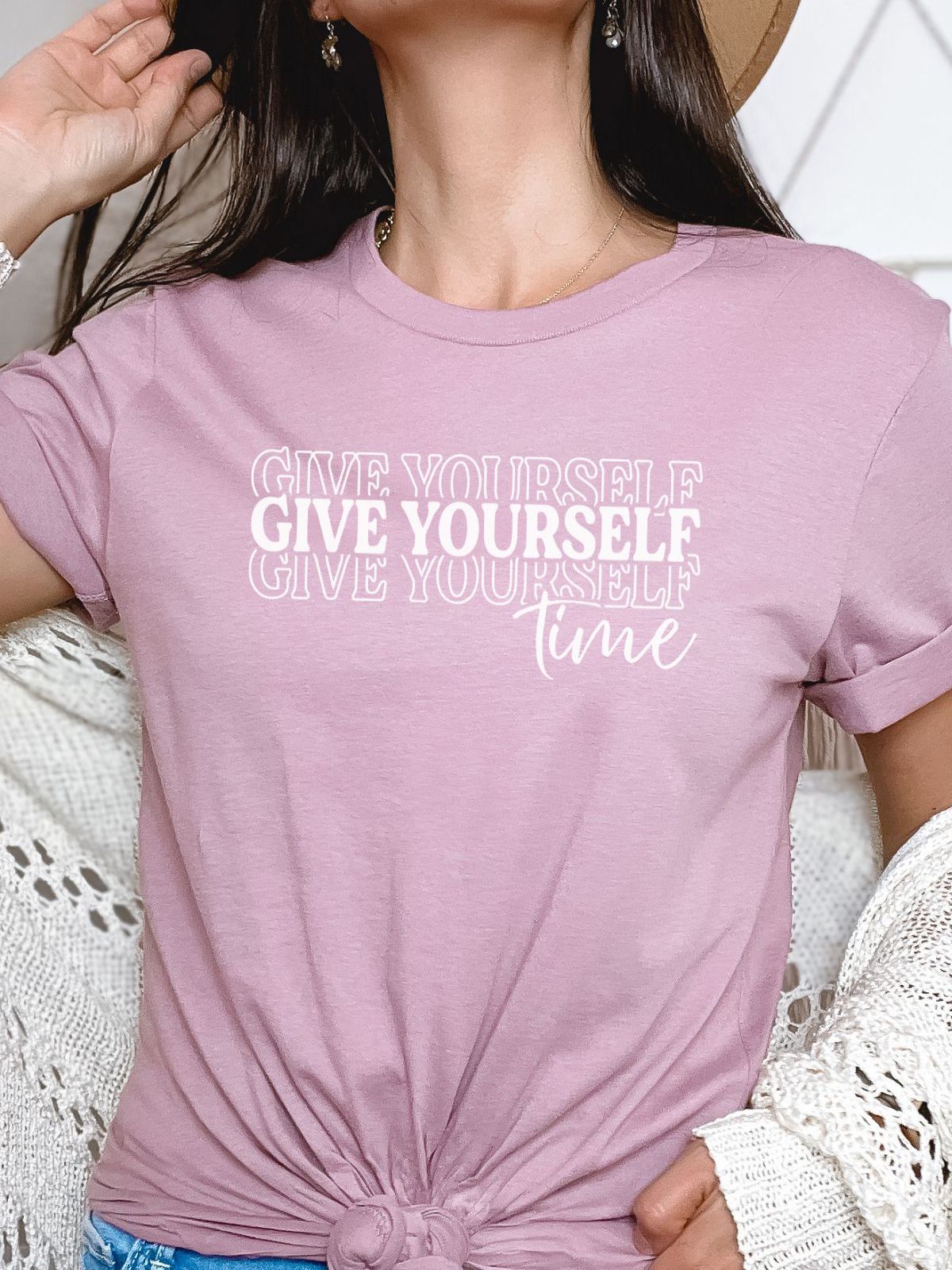 woman wearing pink t-shirt with give yourself time design