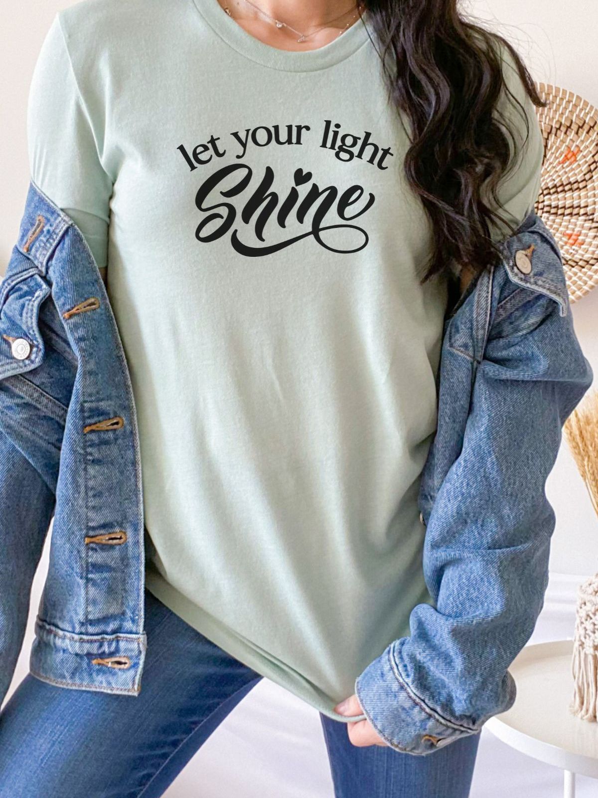 woman wearing let your light shine t-shirt