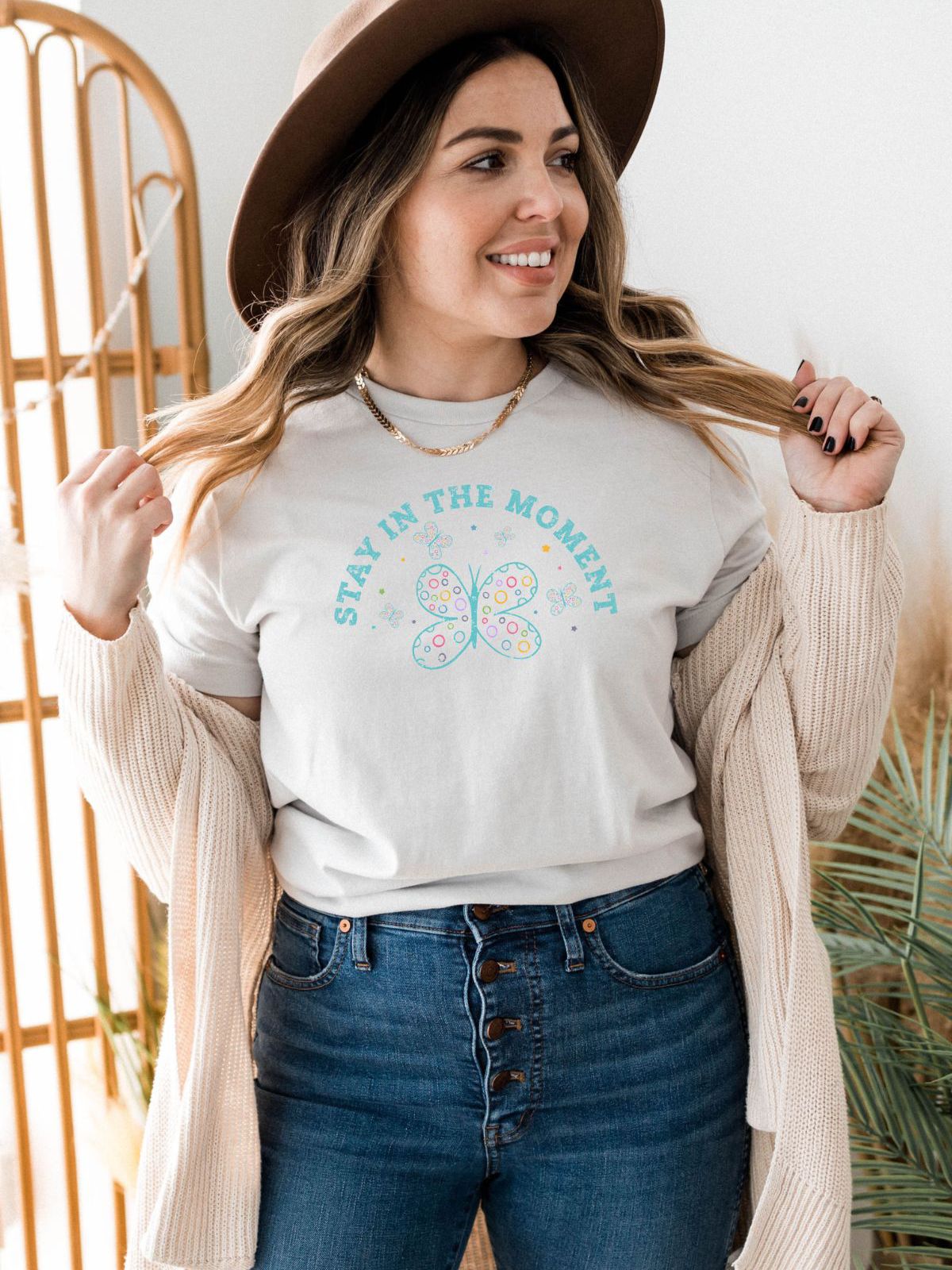 woman wearing Stay in the Moment graphic t-shirt
