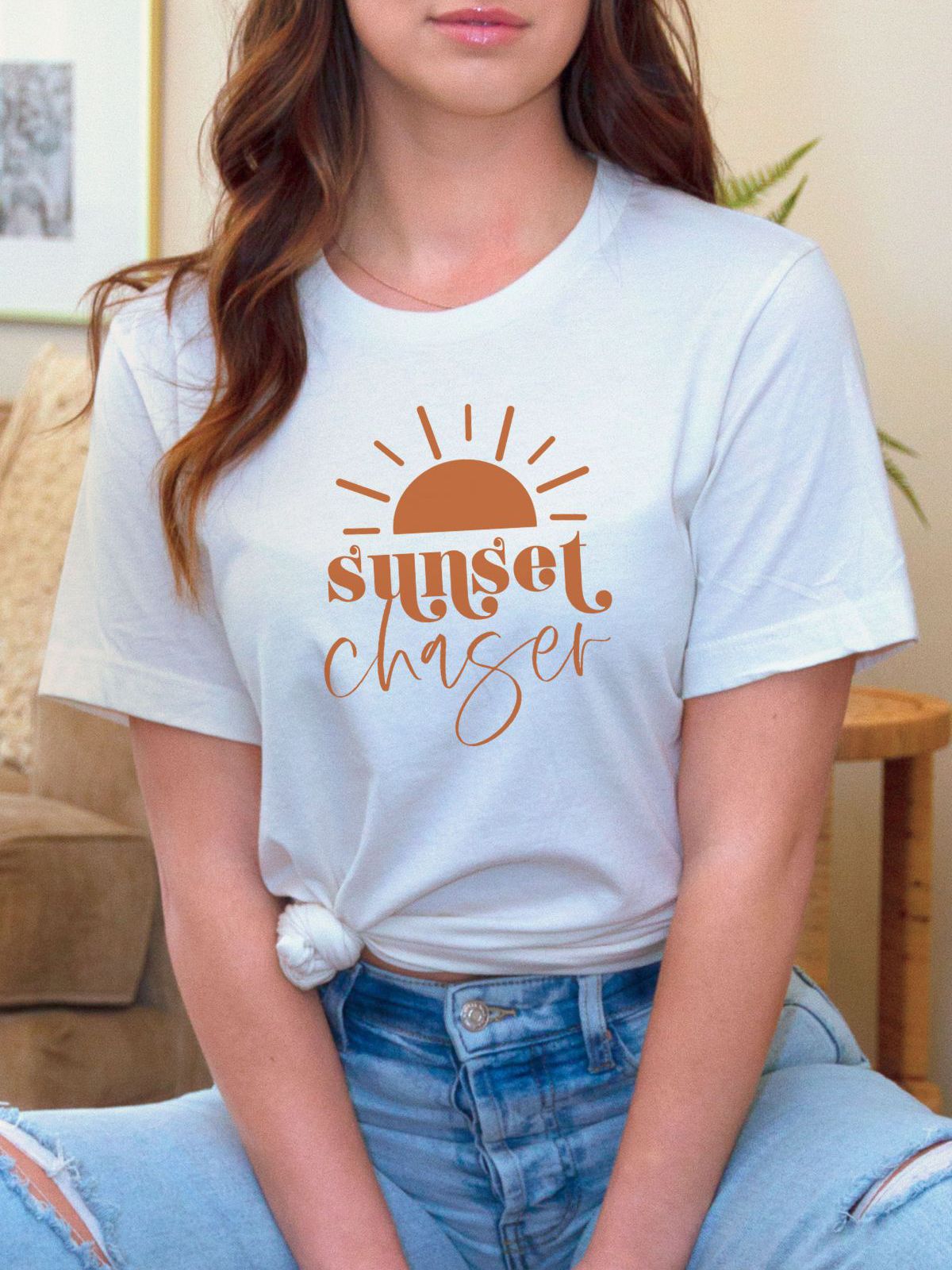 Woman wearing white Sunset Chaser t-shirt
