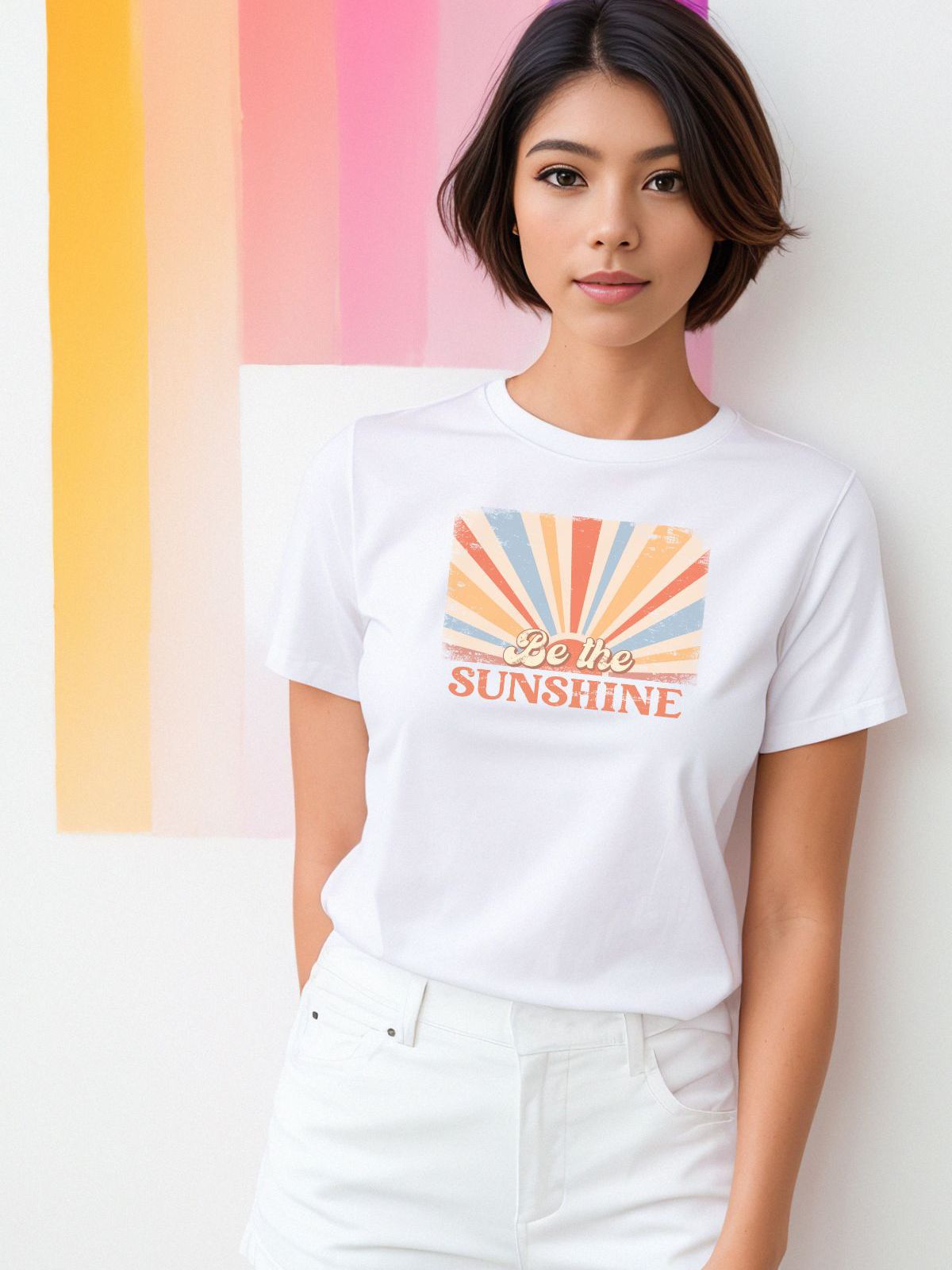 Woman wearing 'Be the Sunshine' graphic t-shirt
