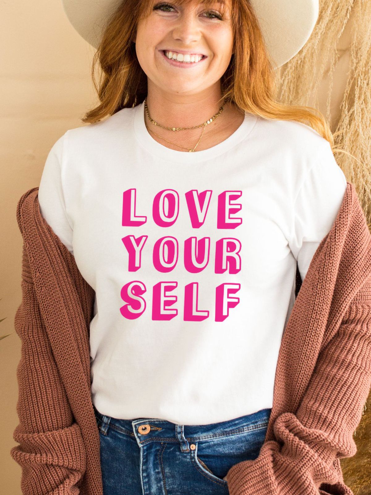 Woman wearing a white t-shirt with Love Your Self text