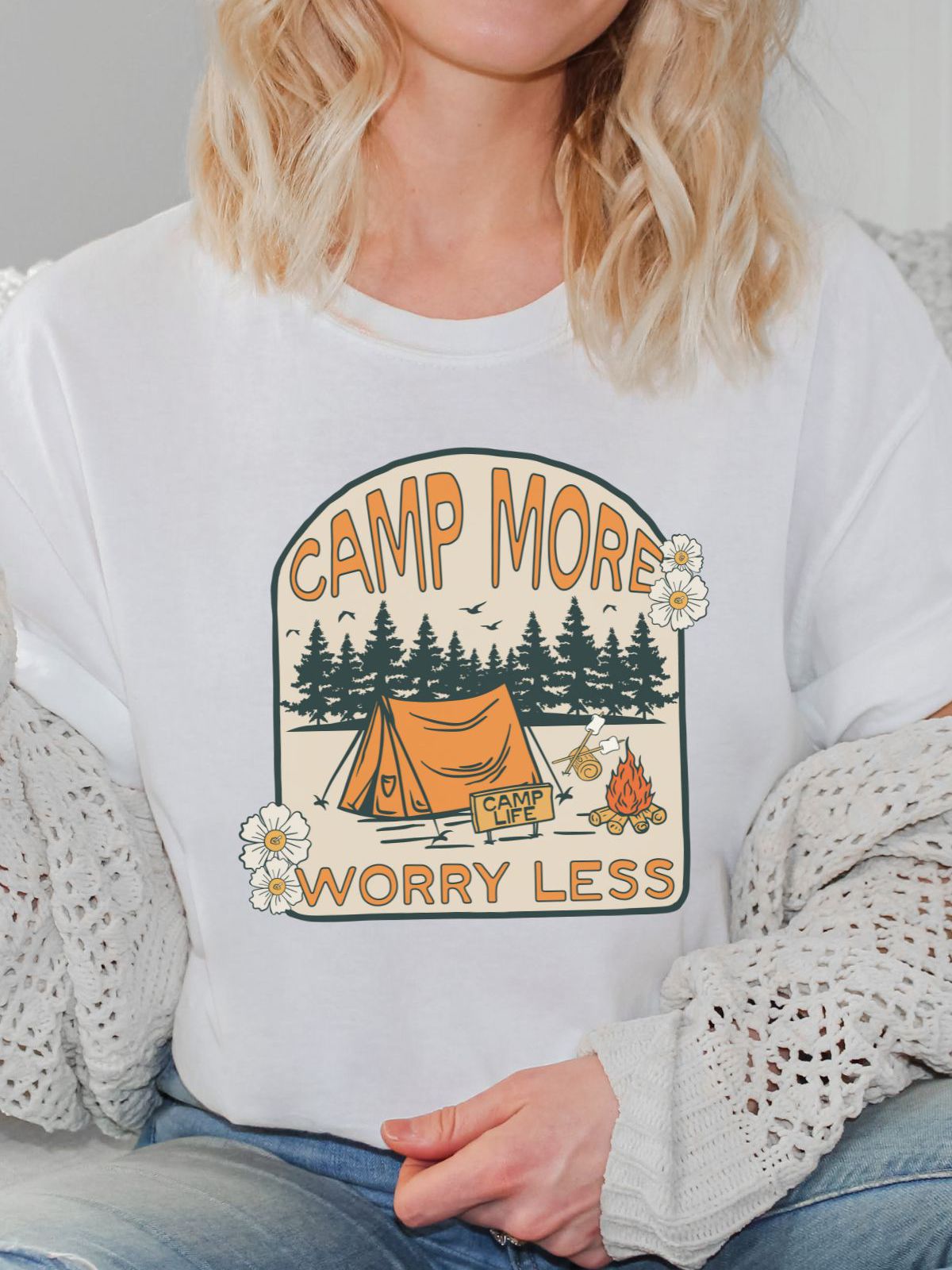 woman wearing camp more worry less t-shirt with tent and campfire