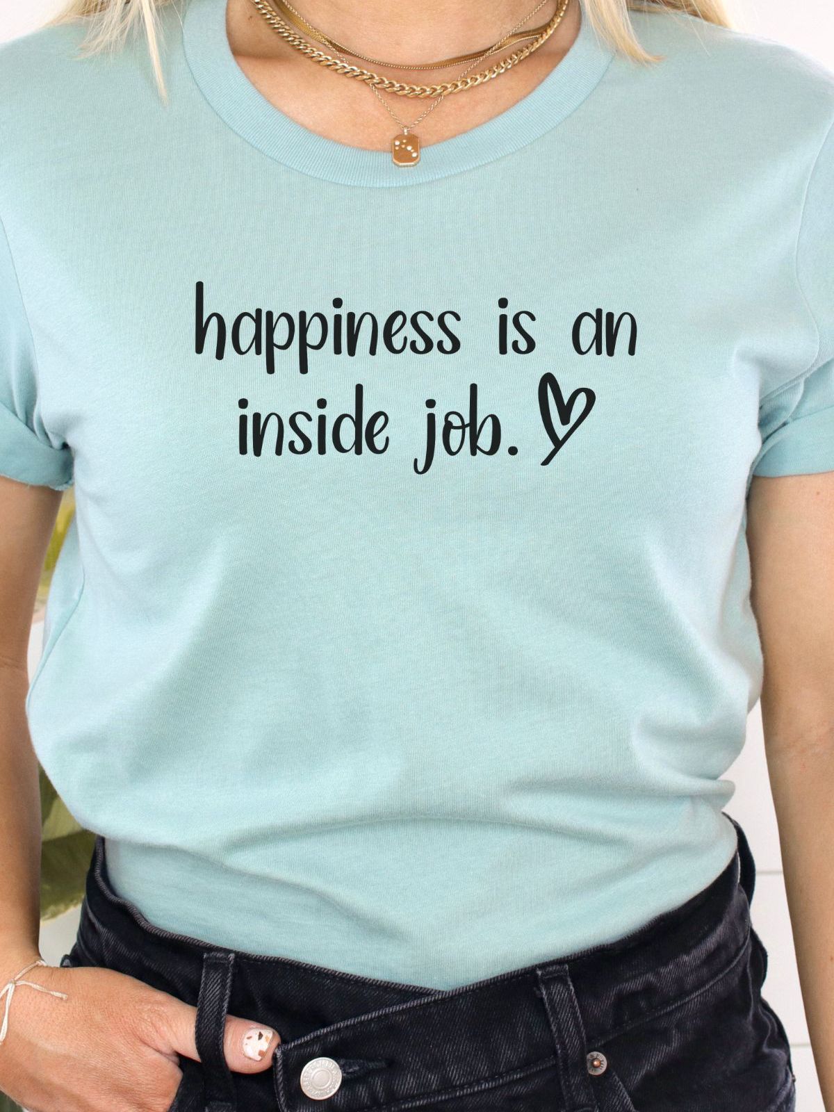 light blue t-shirt with happiness is an inside job text