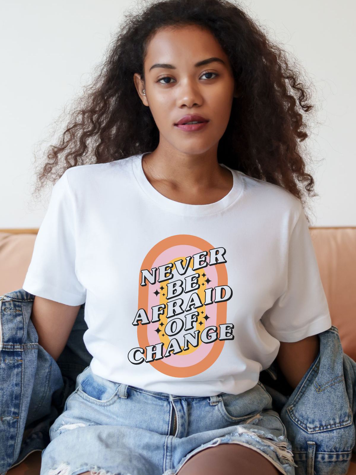 woman wearing a Never Be Afraid of Change graphic t-shirt