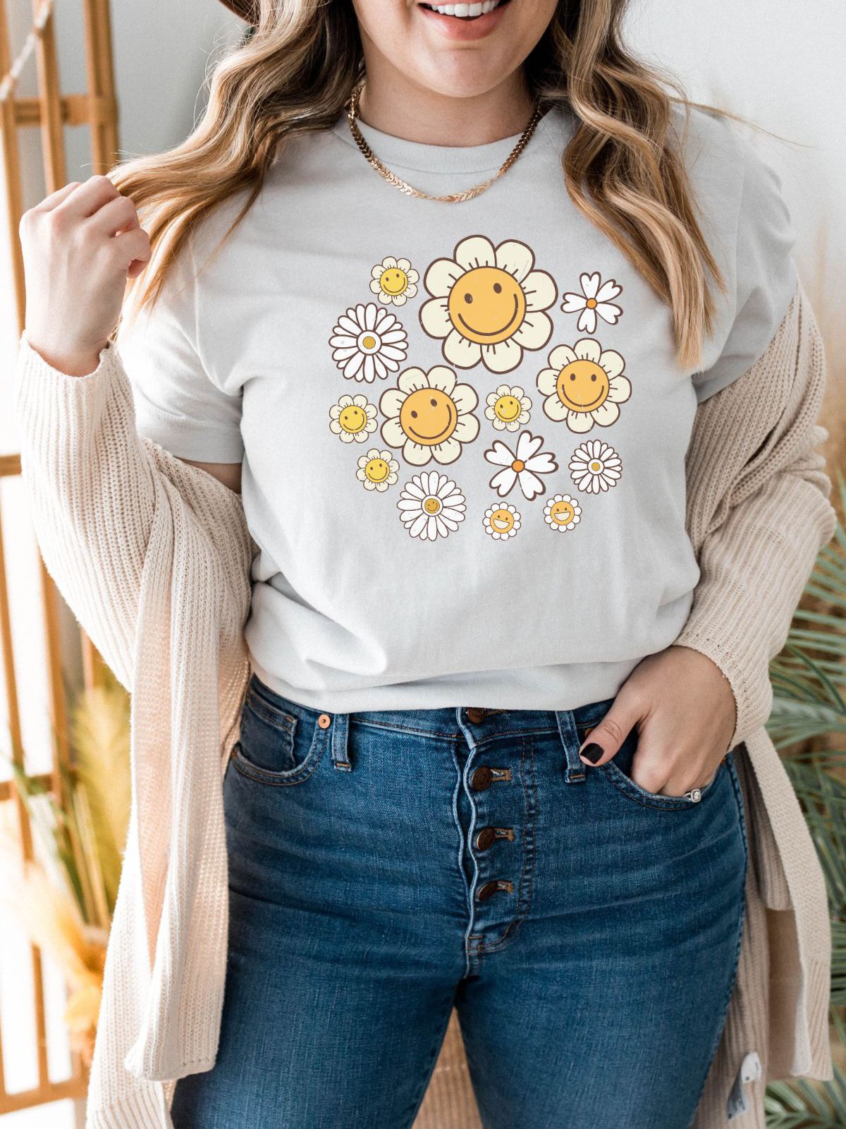 Woman wearing a t-shirt with smiley daisy design