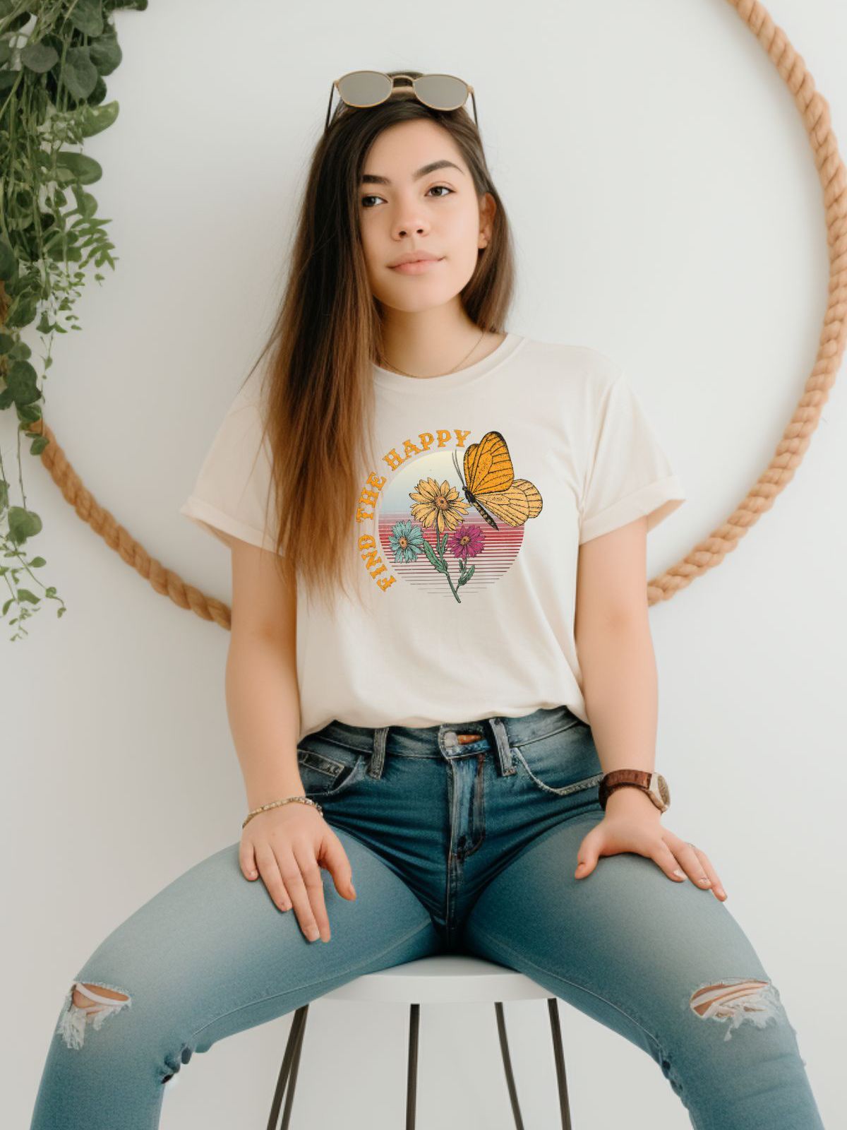 Woman wearing t-shirt with Find The Happy butterfly design