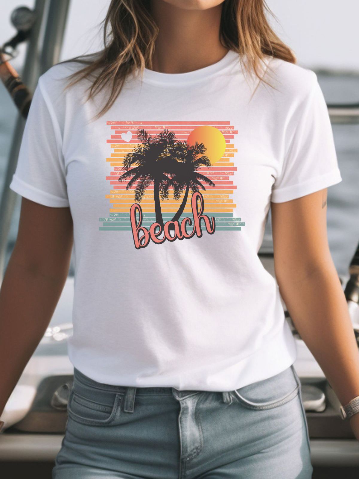 woman wearing beach sunset graphic t-shirt