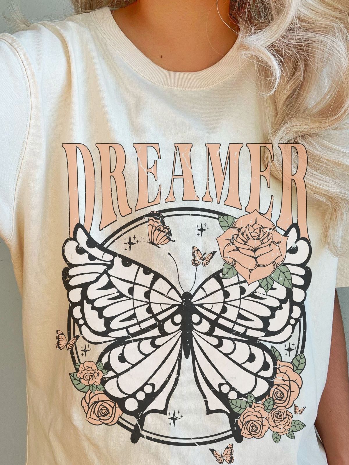 Dreamer butterfly and floral design on a women's tee
