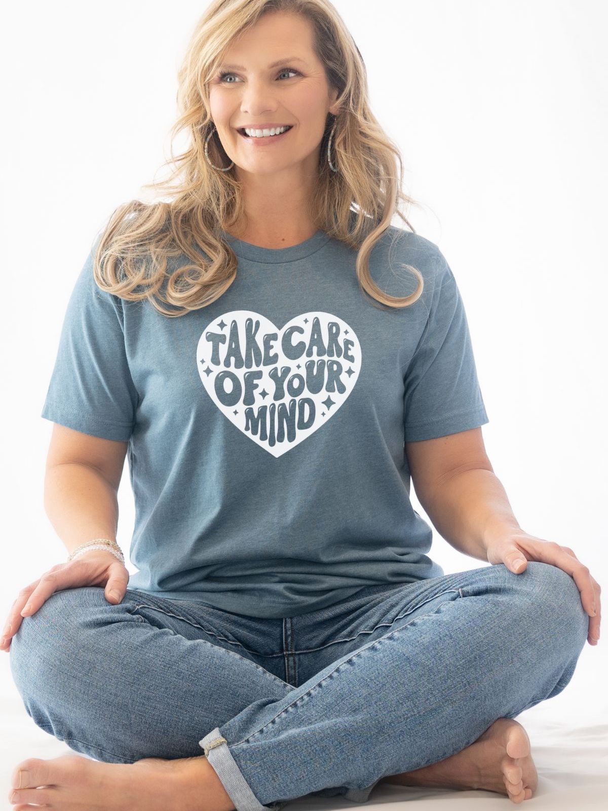 Woman wearing Take Care Of Your Mind t-shirt in blue