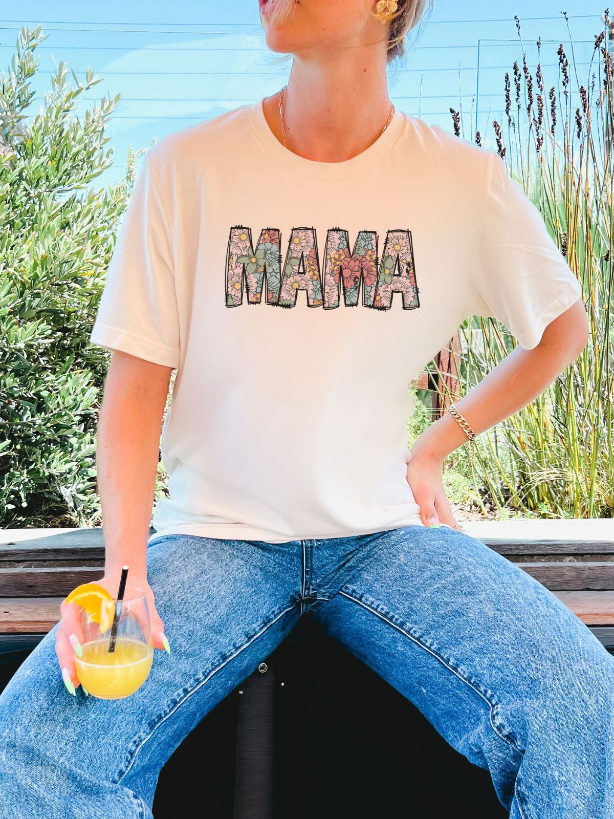 woman wearing mama shirt with floral design