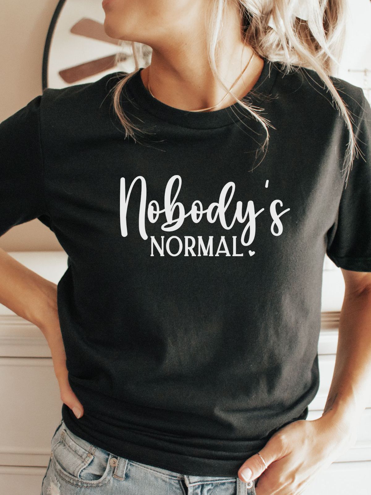 Black t-shirt with Nobody's Normal text
