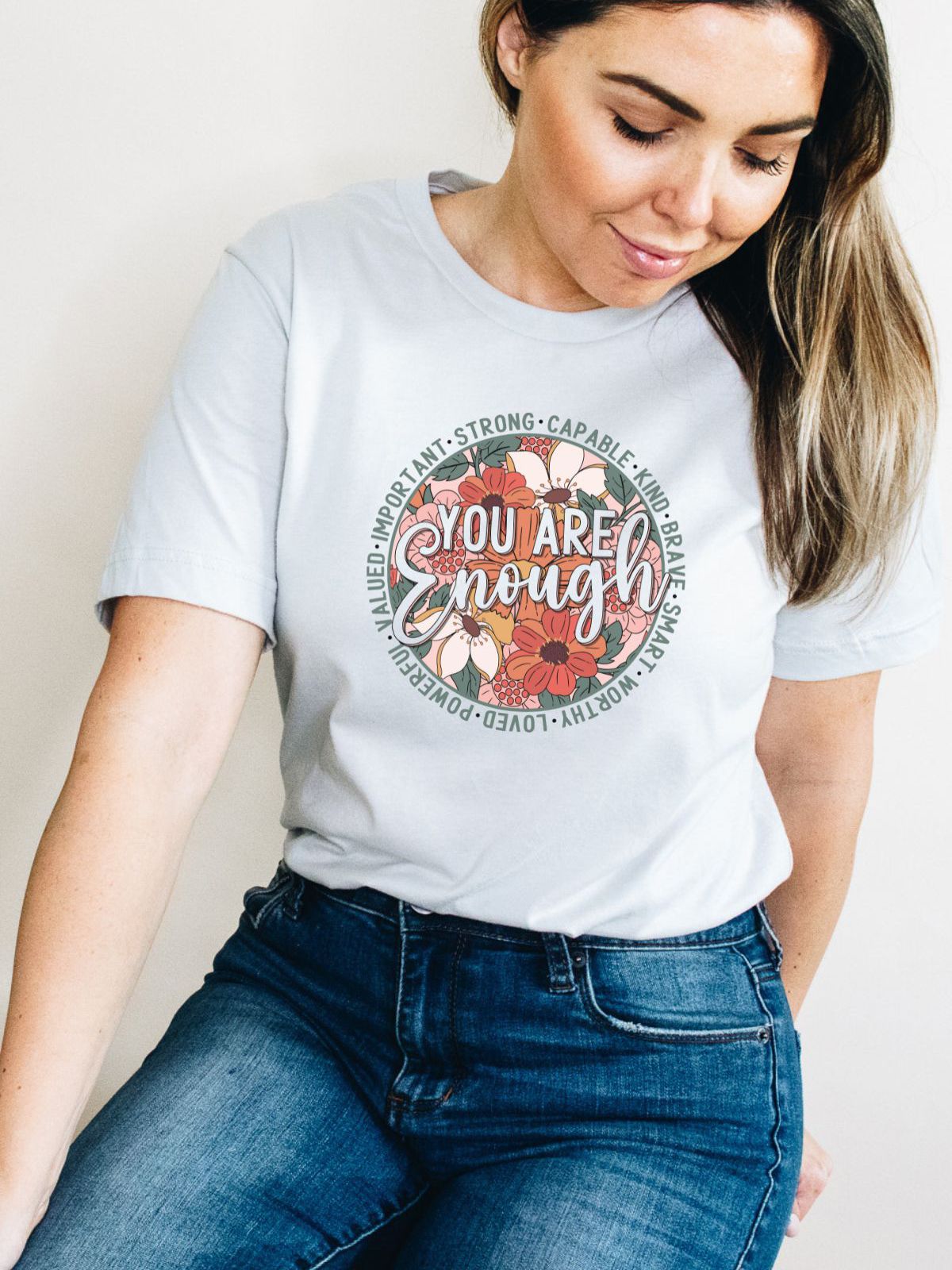 woman wearing you are enough printed t-shirt