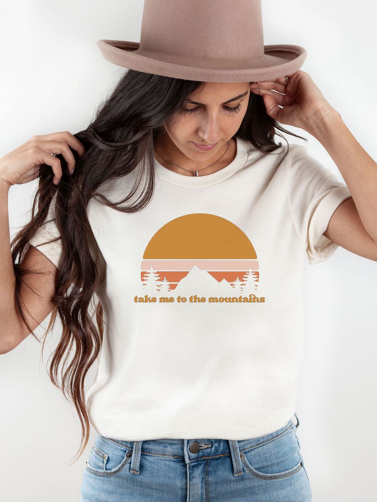 woman wearing take me to the mountains t-shirt