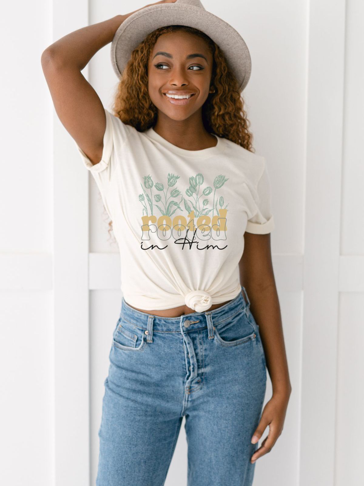 woman wearing rooted in him floral t-shirt