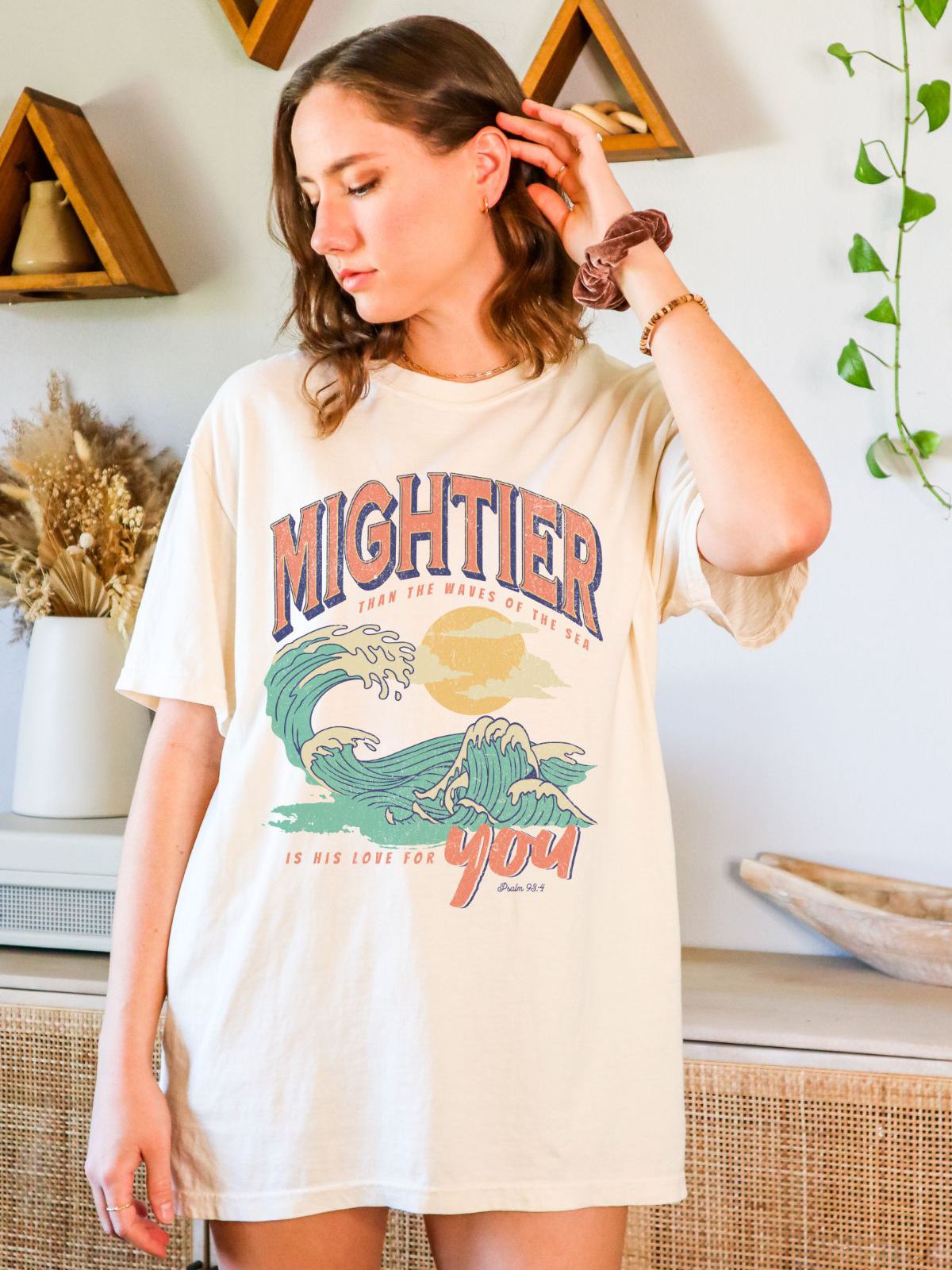woman wearing mightier than the waves graphic t-shirt