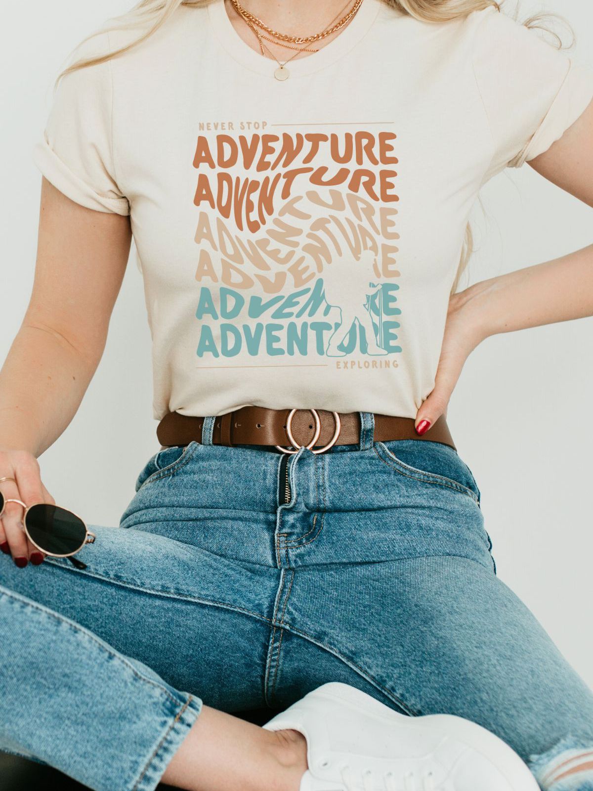 woman wearing adventure themed graphic t-shirt
