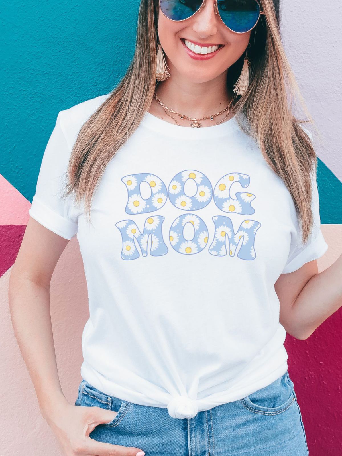 woman wearing Dog Mom t-shirt with floral design
