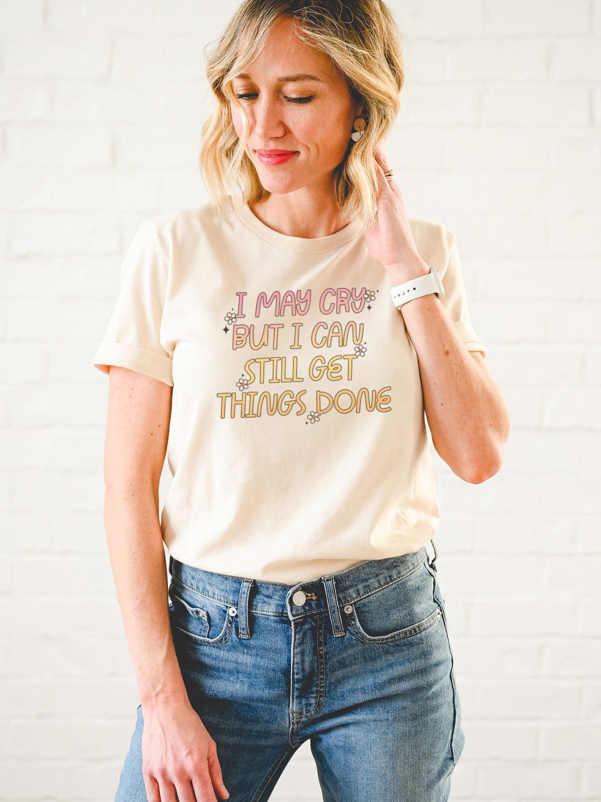 woman wearing a t-shirt with text I May Cry But I Can Still Get Things Done