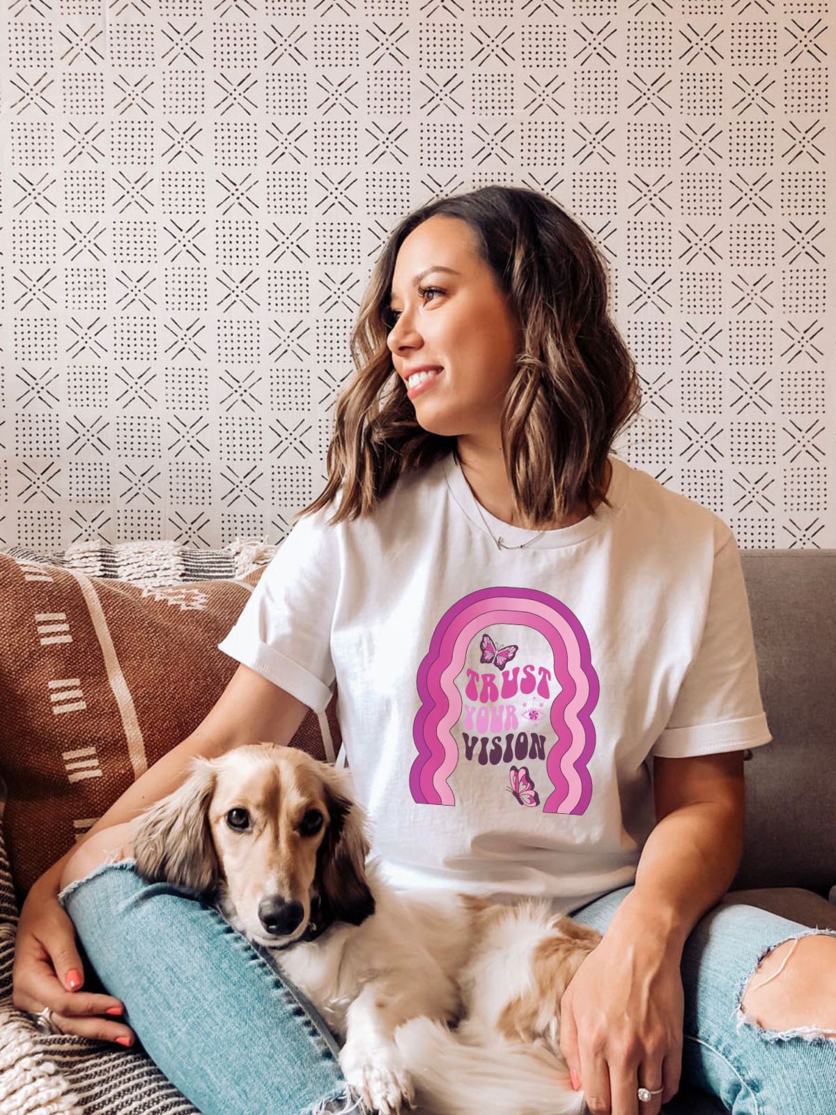 woman wearing Trust Your Vision t-shirt with dog