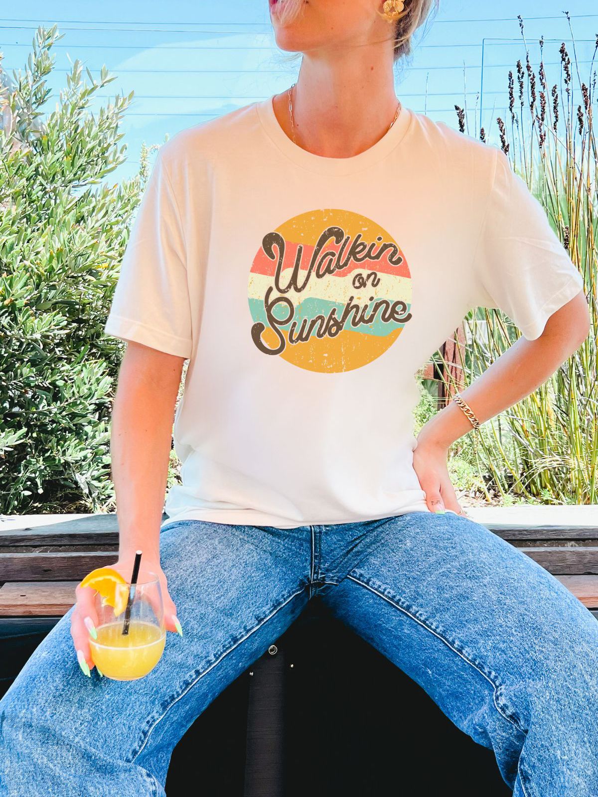 woman wearing Walkin on Sunshine t-shirt