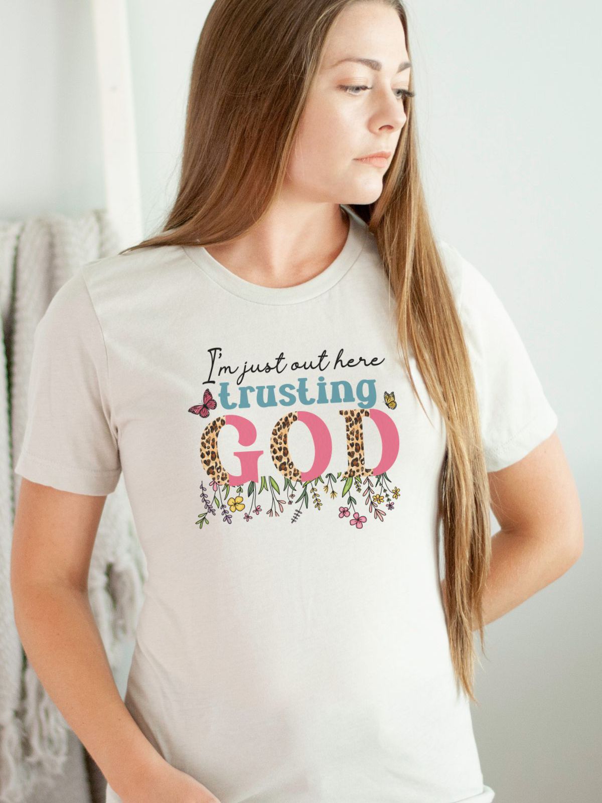 Woman wearing Trusting God graphic t-shirt