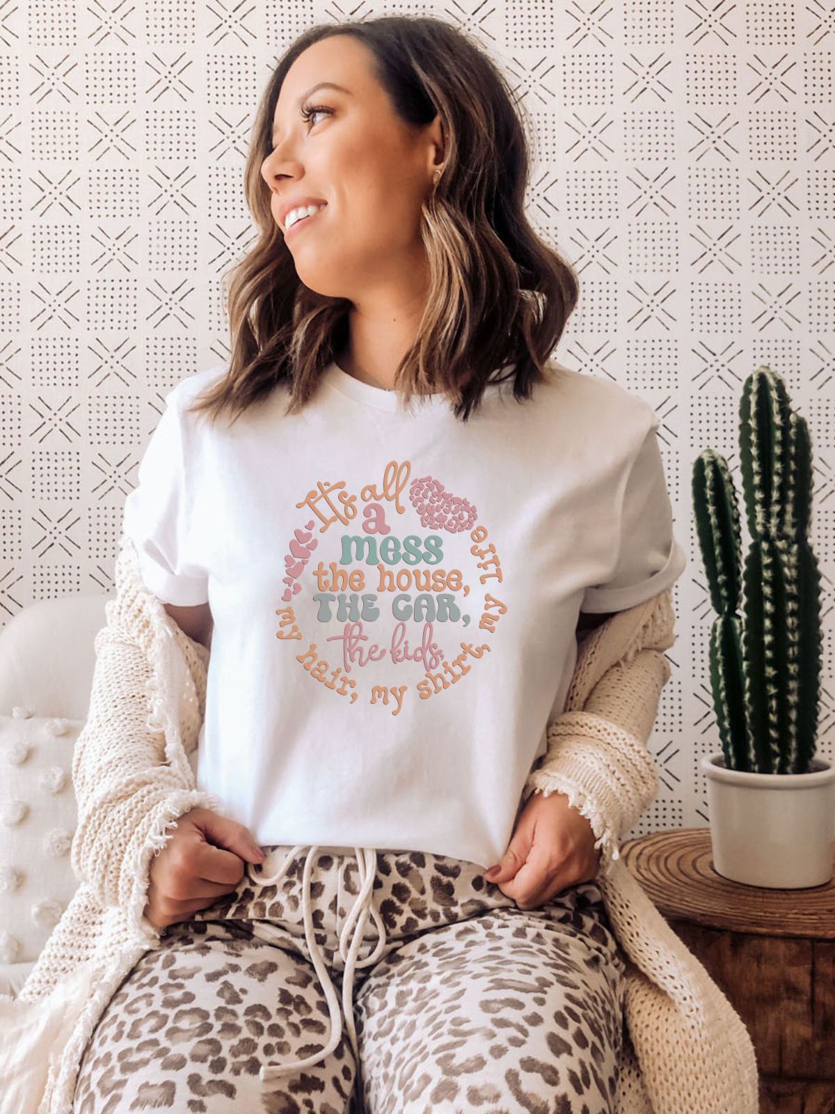 woman wearing a white t-shirt with mess quote design