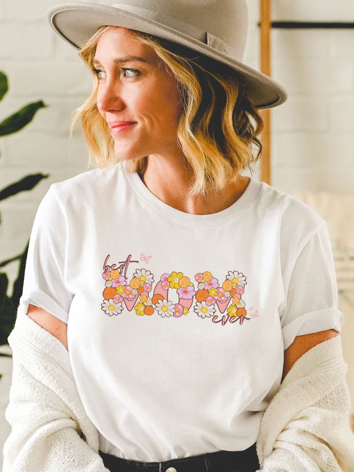 Woman wearing Best Mom Ever floral t-shirt