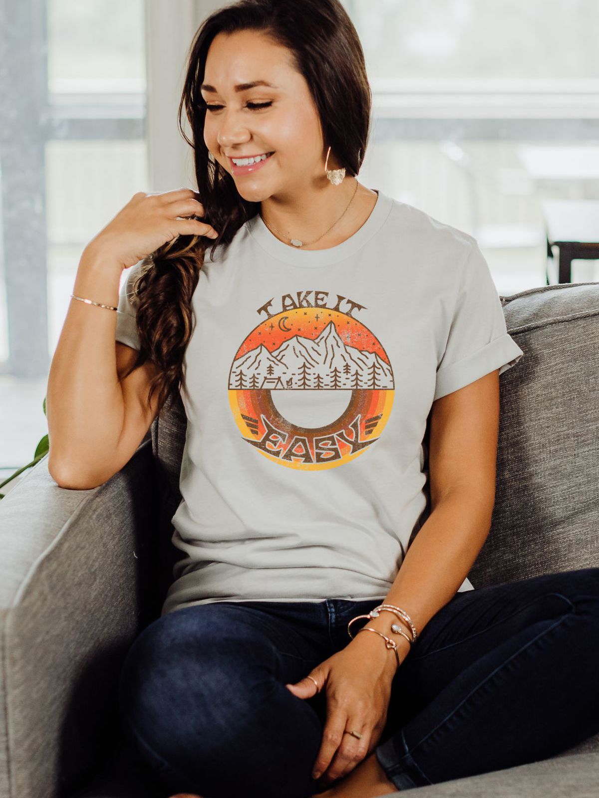 woman wearing Take It Easy mountain sunset t-shirt