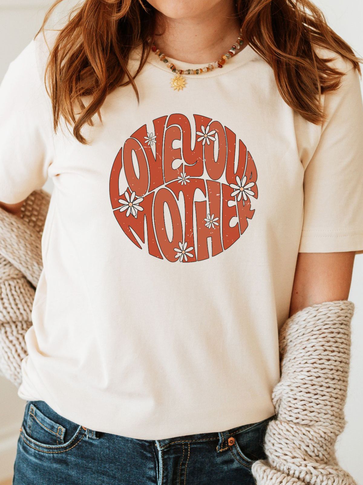 woman wearing t-shirt with Love Your Mother design