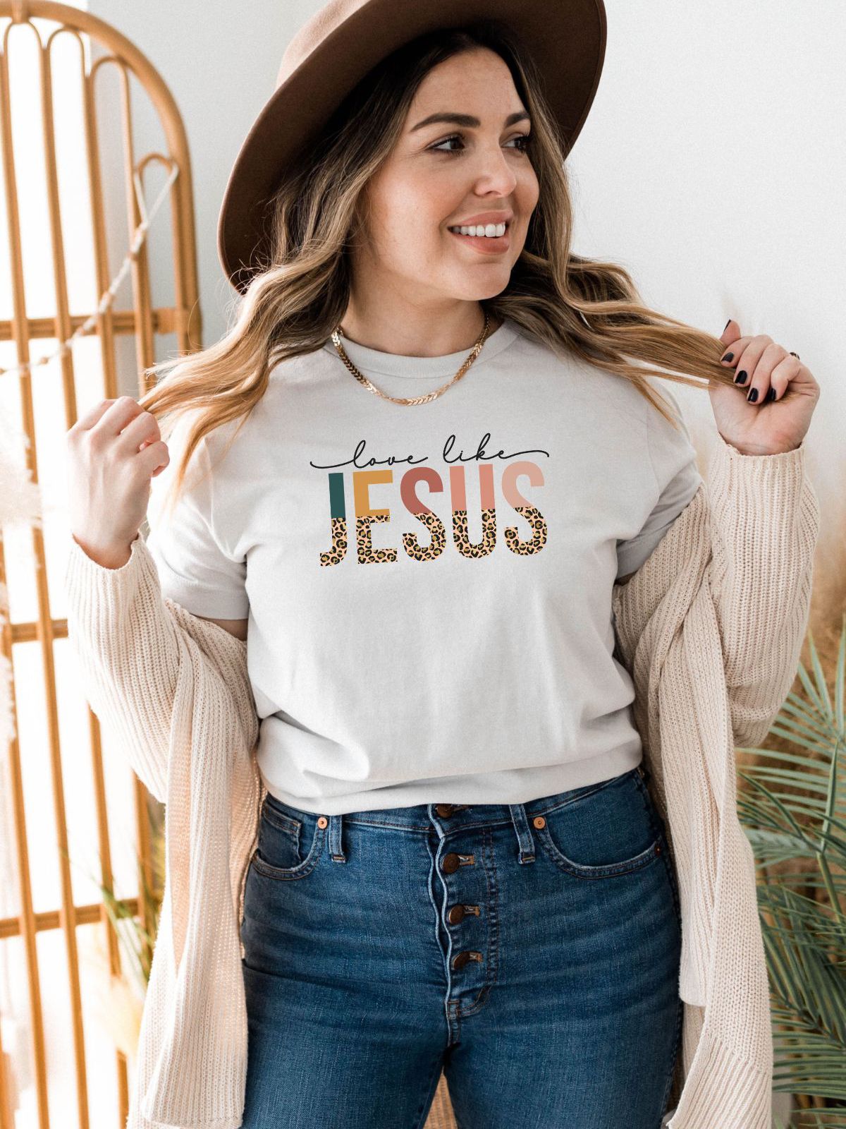 woman wearing Love Like Jesus T-shirt with hat