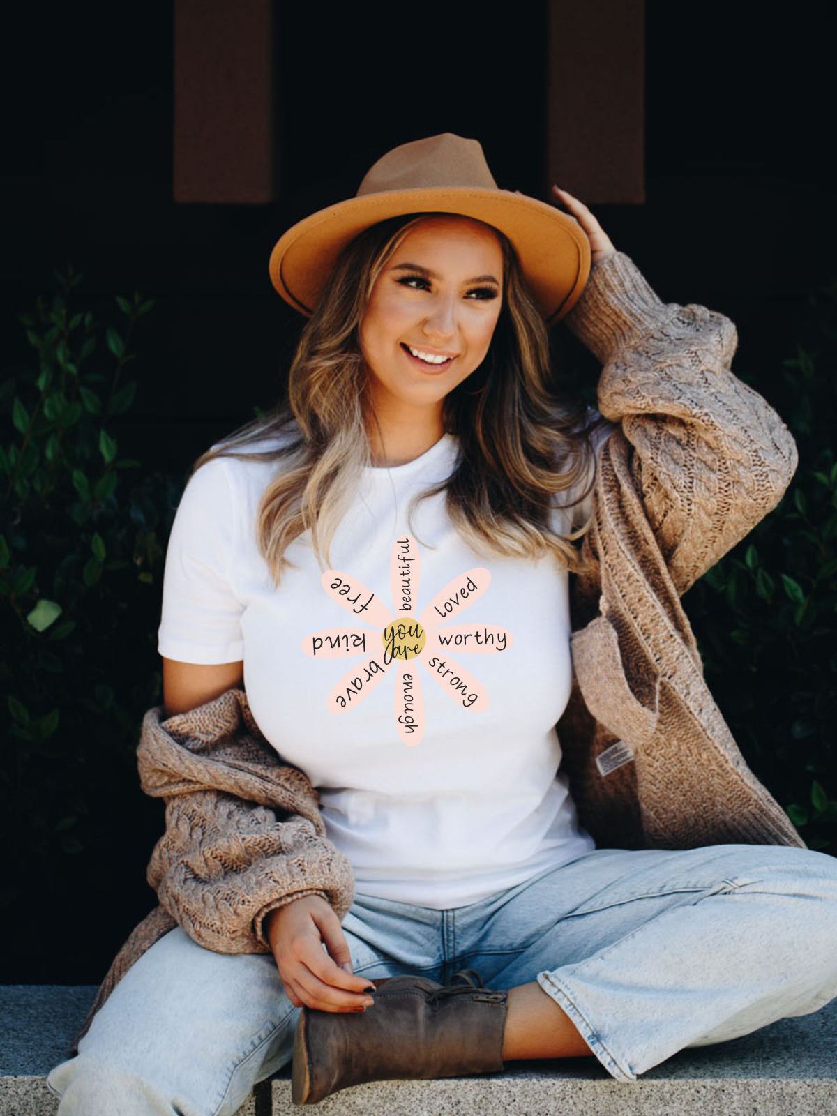 woman wearing white t-shirt with empowering words