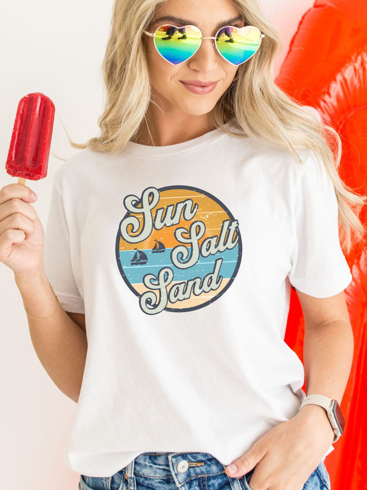 woman wearing sun salt sand t-shirt with sunglasses