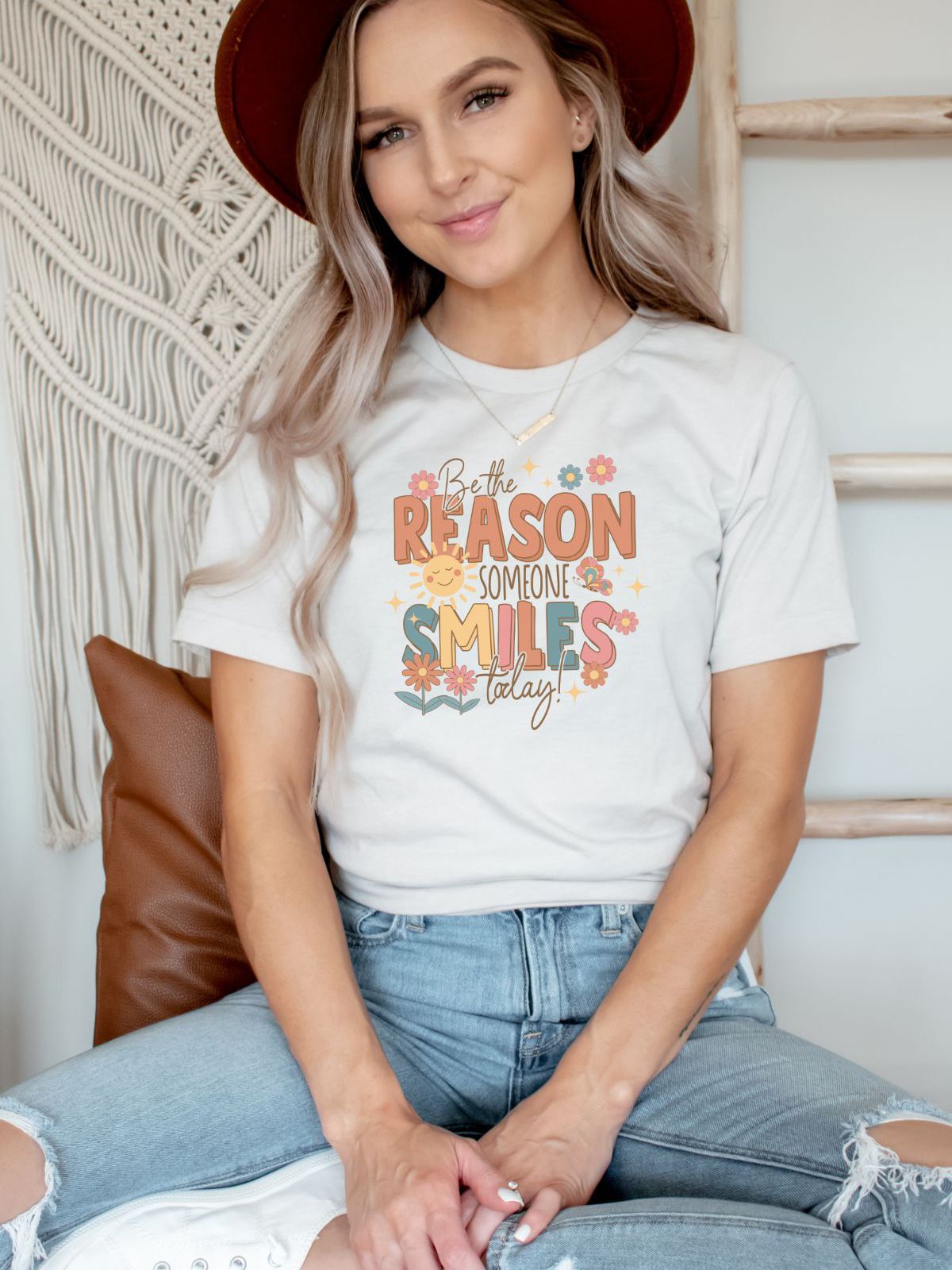 woman wearing be the reason someone smiles today t-shirt