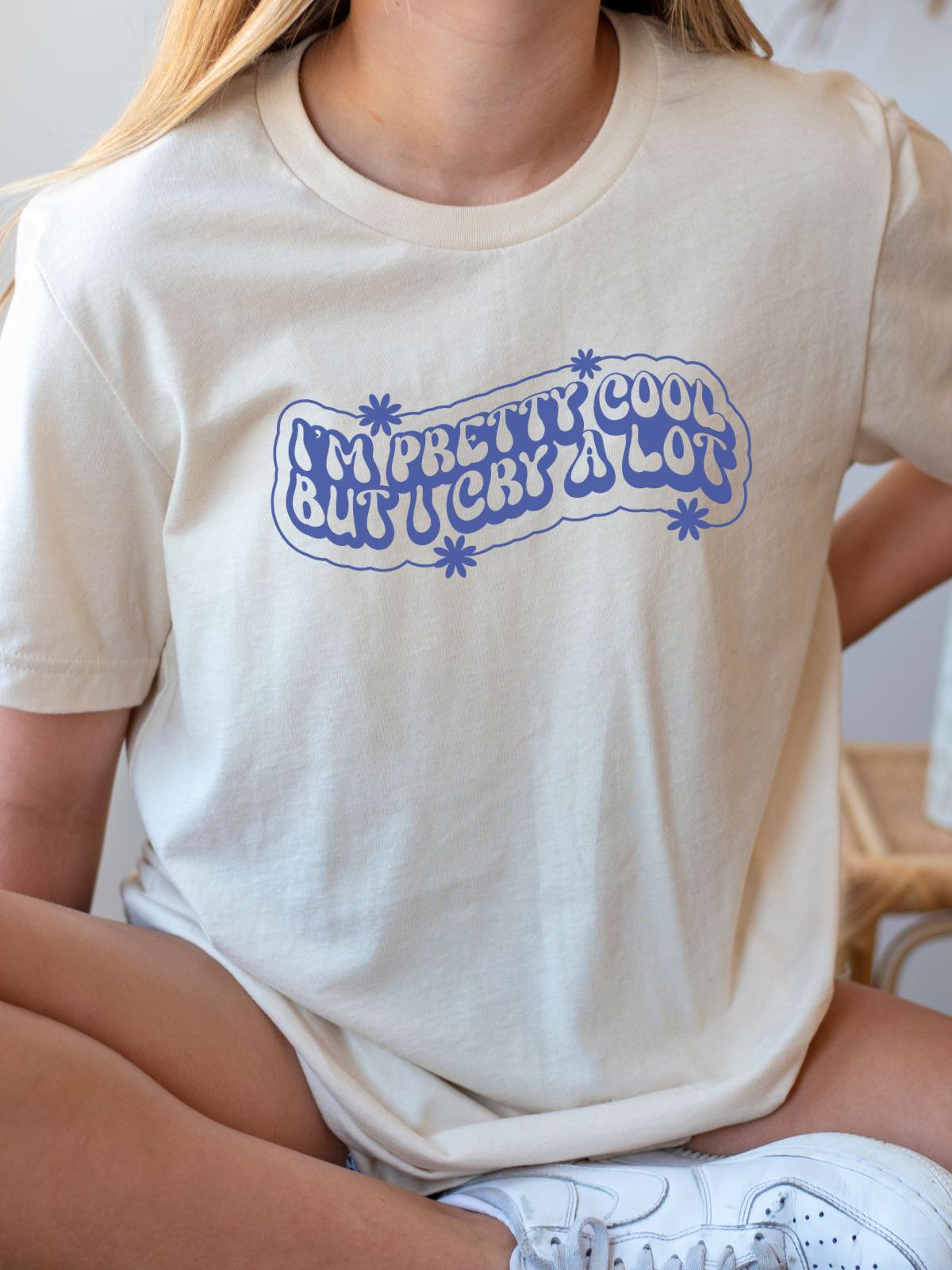 beige t-shirt with I'm Pretty Cool But I Cry A Lot text