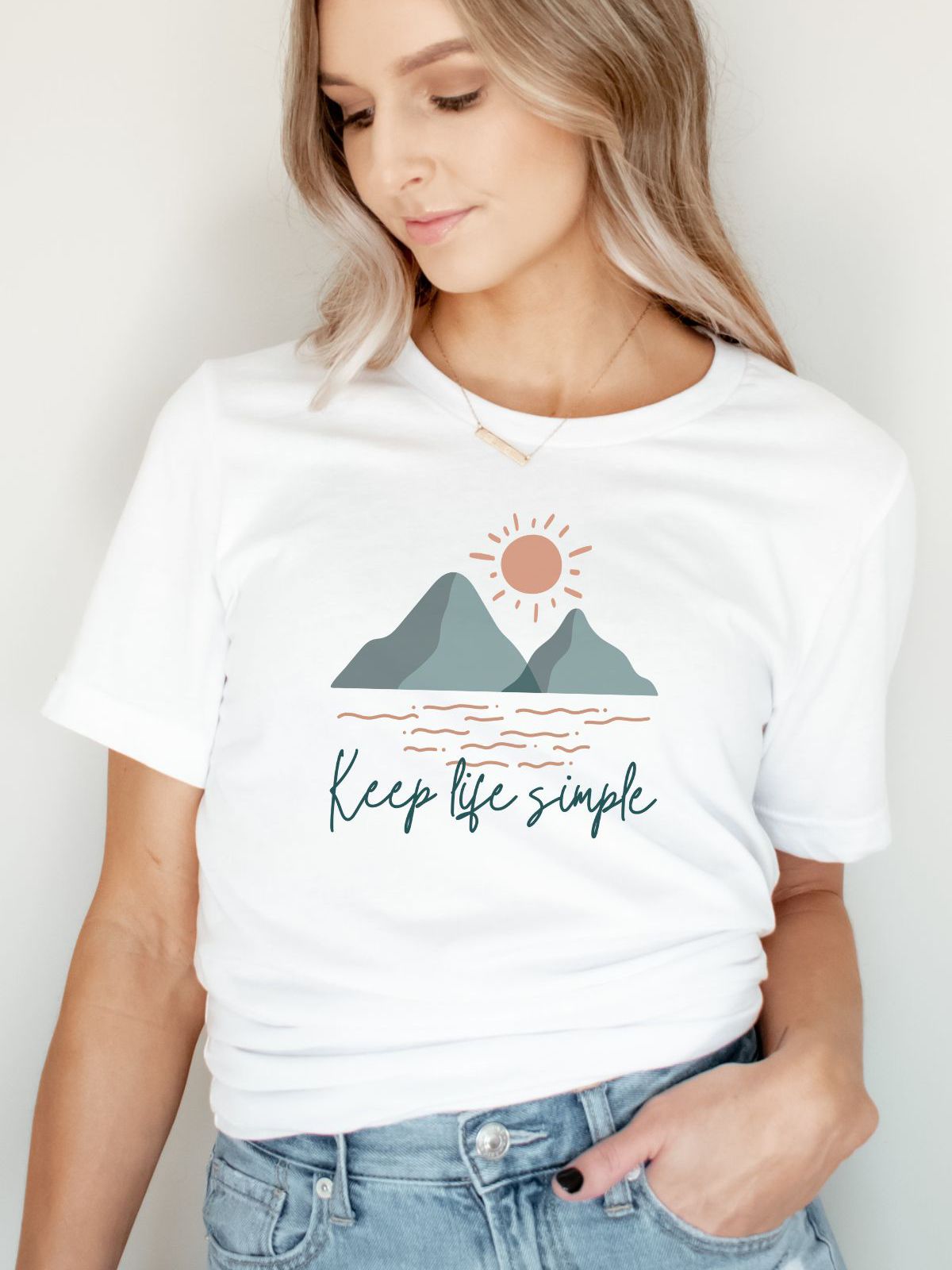 woman wearing keep life simple t-shirt