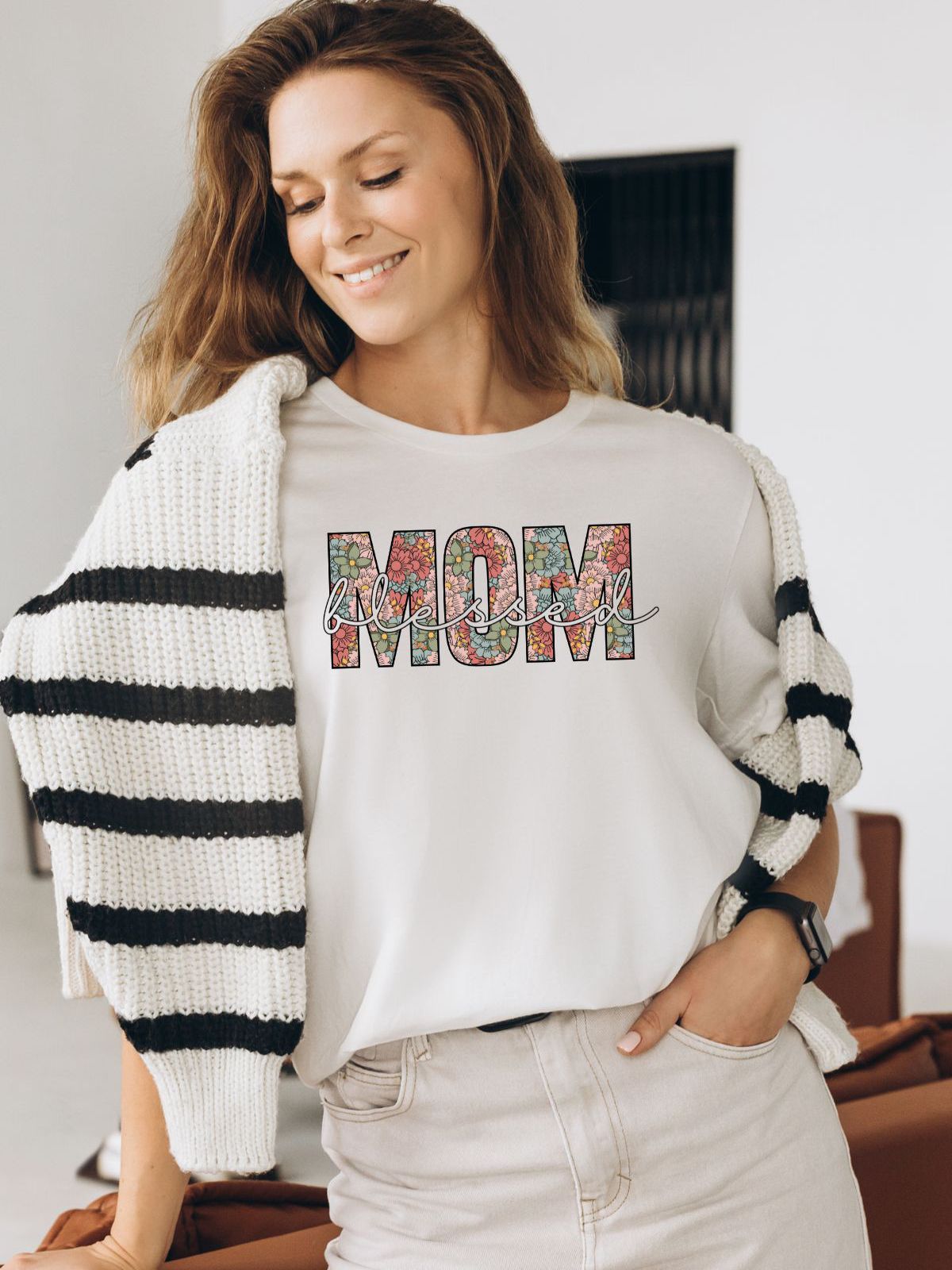 Woman wearing a floral Mom blessed t-shirt