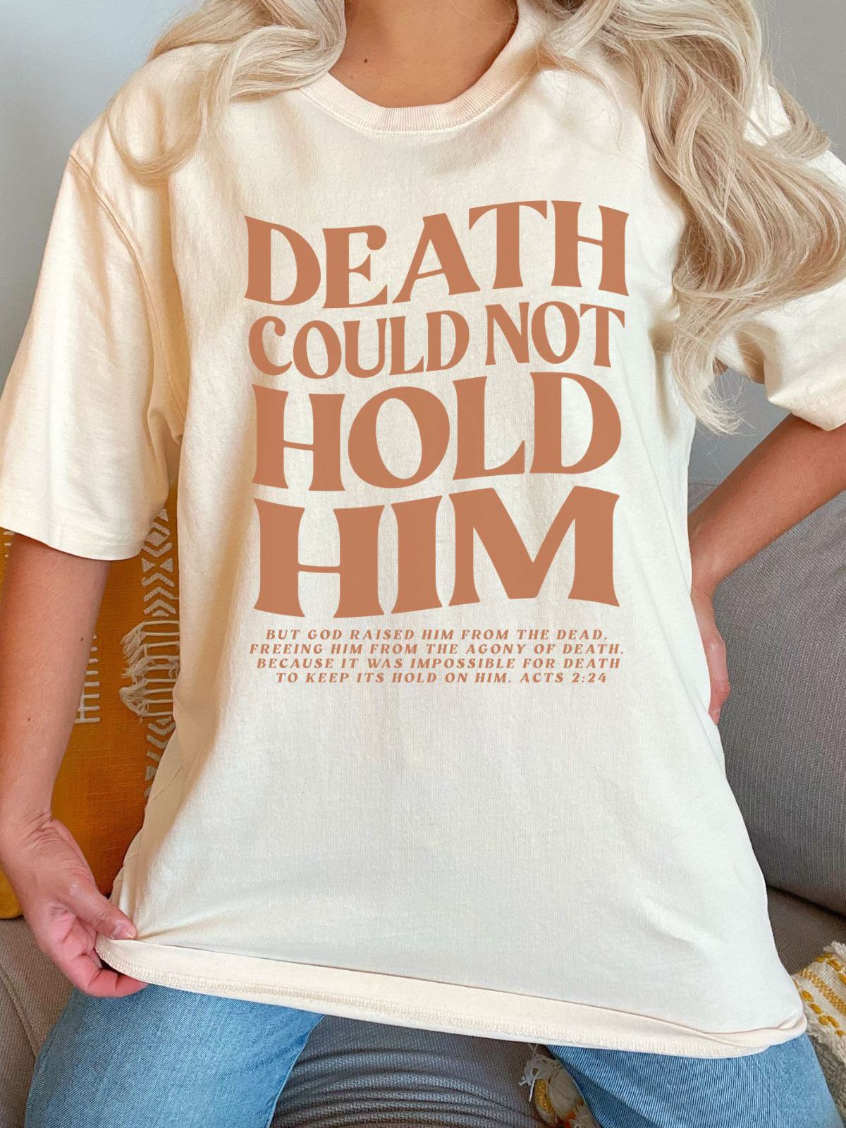 Beige t-shirt with Death Could Not Hold Him text design