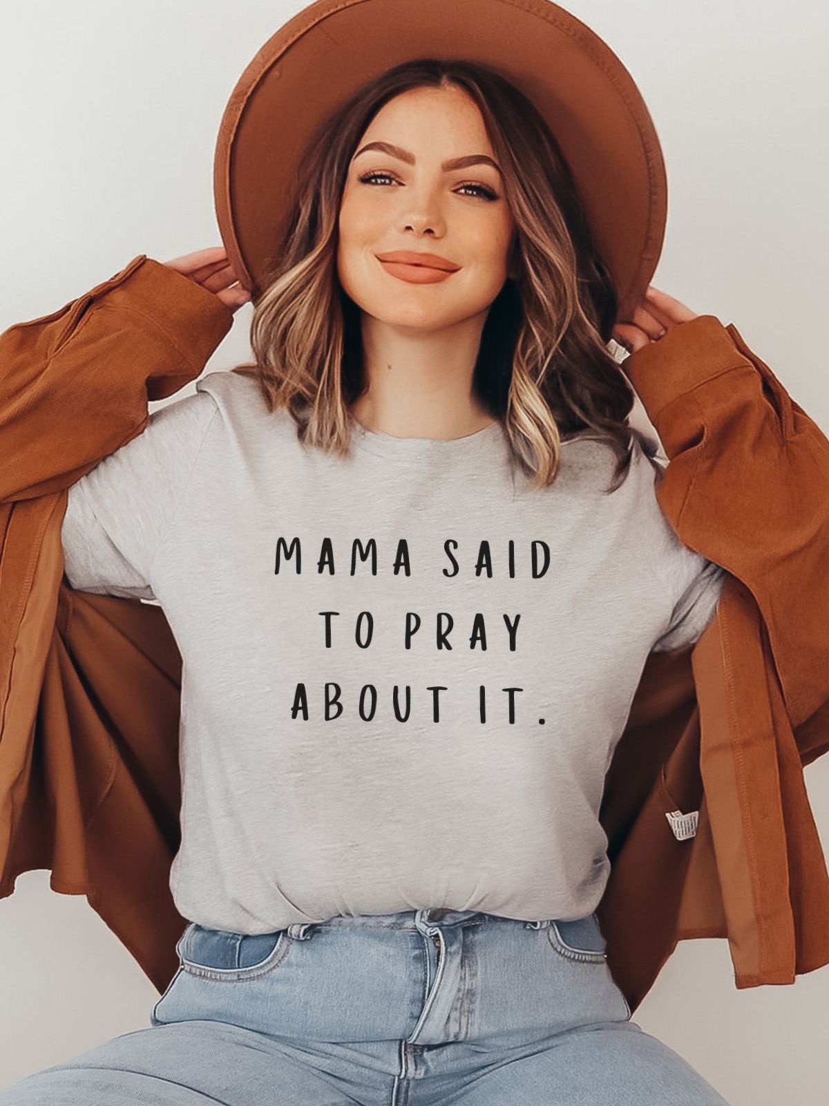 Woman wearing Mama Said Pray About It t-shirt
