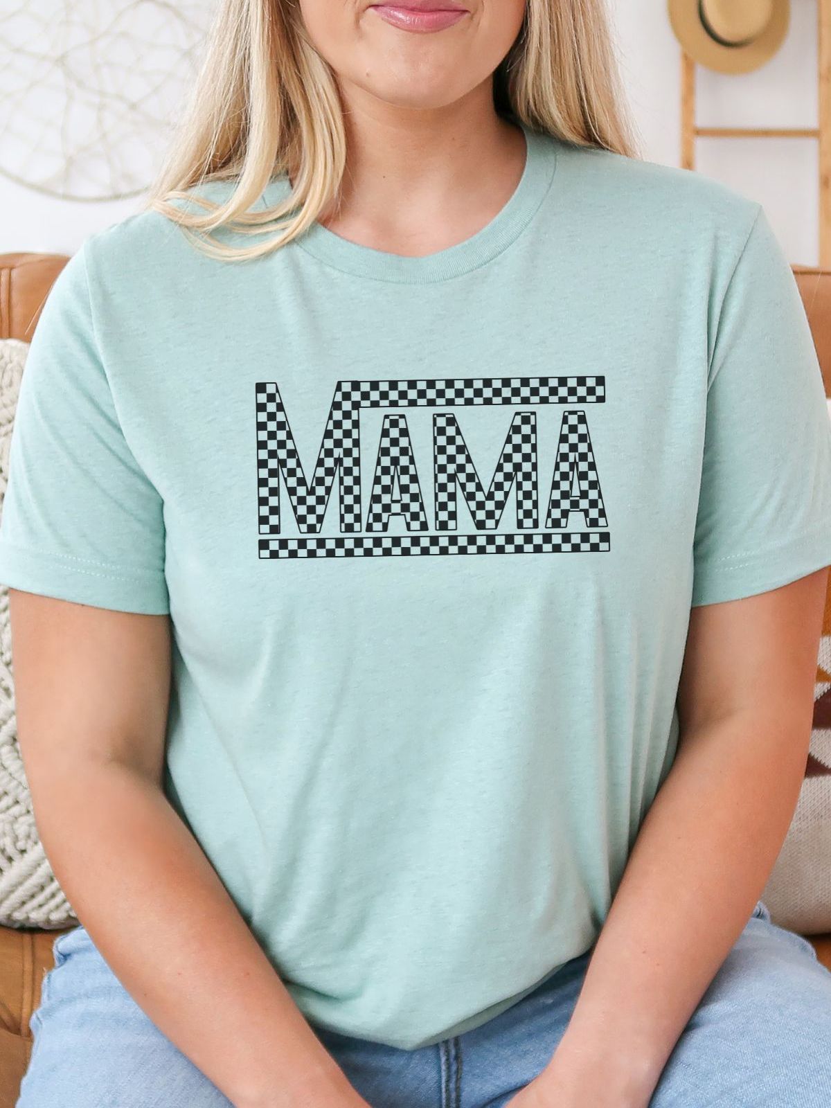 woman wearing mint green t-shirt with Mama design