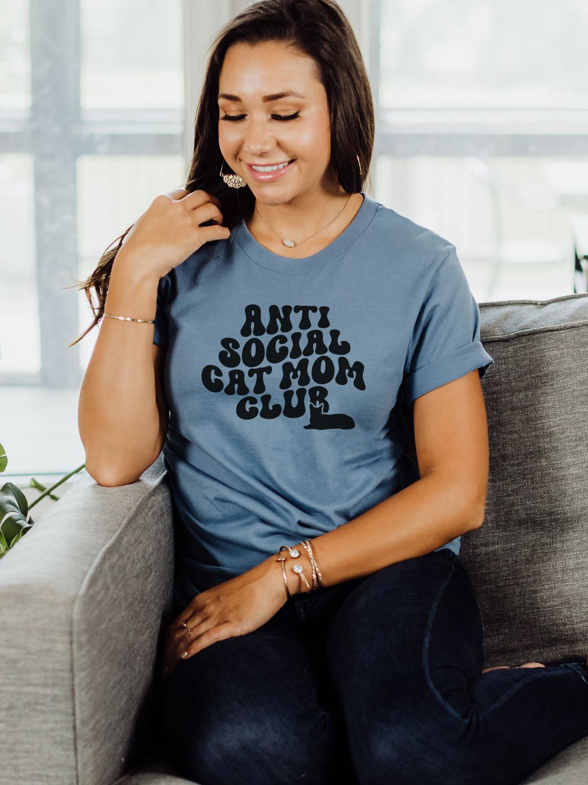 woman wearing anti social cat mom shirt